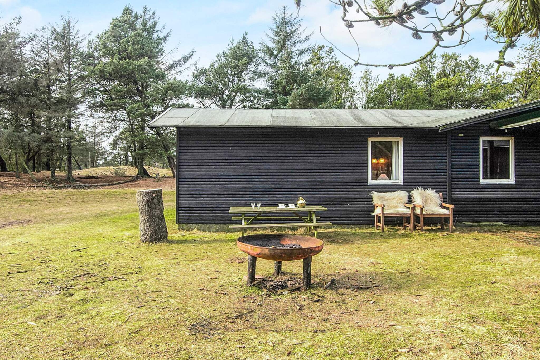 Røgegård, also known as the Deer Cabin (Hjortehytten), is a completely unique and charming sanctuary located deep in nature. Here, you reside surrounded by tranquility, forest, and open fields, where fallow deer frequently roam freely around the property. This setting makes it an ideal retreat for all nature lovers seeking peace, authentic surroundings, and a genuine connection with the outdoors. The house itself is an older, cozy hunting lodge filled with character and soul. Guests can completely disconnect from daily life, take deep breaths, and savor the silence—perhaps while enjoying a cup of coffee outdoors and taking in the vast landscape. The focus of a stay at Røgegård is where nature, presence, and simplicity go hand in hand, making it perfect for a truly relaxing and rejuvenating experience. Despite its secluded natural location, the cabin is conveniently located only about 2 km from one of Denmark's best beaches. When the wind is blowing just right, you can even hear the gentle rush of the waves from the property itself. Røgegård is the ultimate spot for those looking to combine profound relaxation with easy access to beautiful coastal scenery.A refundable deposit might be charged closer to your check-in date. The security deposit ensures a smooth stay and covers any additional services or consumption charges.This deposit covers utilities consumed during your stay and any additional services that may be taken.The final amount will be adjusted based on actual meter readings, actual usage of extra services, and any remaining balance will be refunded within 21 days after checkout.This deposit simply acts as a prepayment for charges that  you would anyways pay for, ensuring a seamless stay and check-out experience.