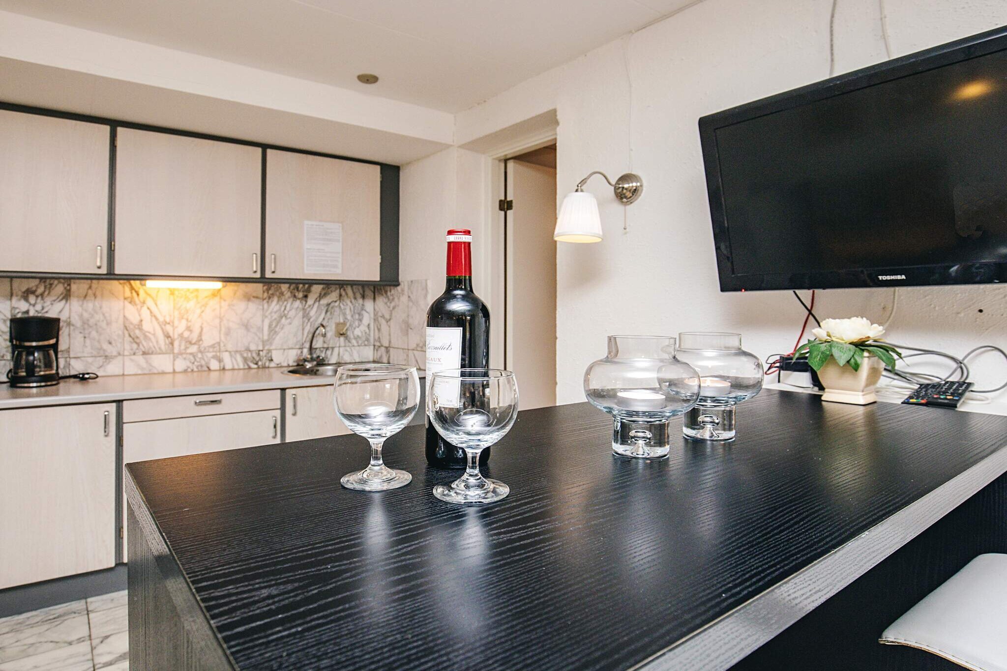Kitchen(cooker(electric), coffee machine, fridge(+ freezer)), Living/bed room(TV), bedroom(2x double bed), bathroom(washbasin, shower, toilet), washing machine, terrace, garden furniture, swimming pool(indoor)