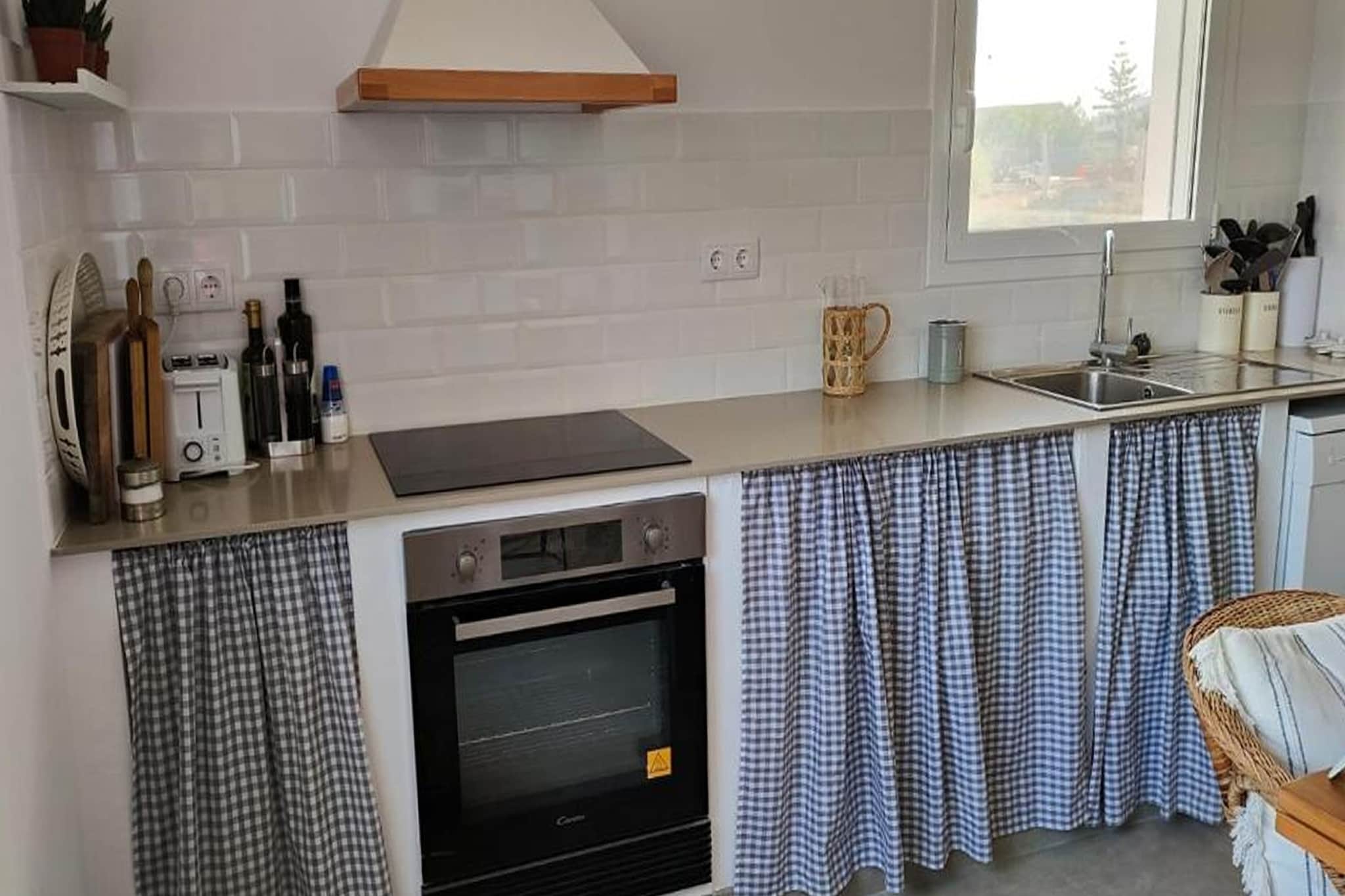 Ground floor: (Entrance(reachable from the outside), Large kitchen(hob, electric kettle, toaster, hood, coffee machine, oven, microwave, dishwasher, fridge-freezer), Living/diningroom(TV(flatscreen), dining table, fireplace, seating area), Bedroom with bathroom(double bed(150 x 190 cm), shower, washbasin, toilet), Bedroom with bathroom(single bed(90 x 190 cm), single bed(90 x 190 cm), shower, washbasin, toilet), Bedroom with bathroom(double bed(150 x 190 cm), shower, washbasin, toilet), heating)\n\nOn the 1st floor: (Living room(seating area, play equipment), Bedroom with bathroom(double bed or 2 single beds, shower, washbasin, toilet), heating)\n\nwashing machine, garden doors, patio, terrace, parking lot(public), ironing board, iron
