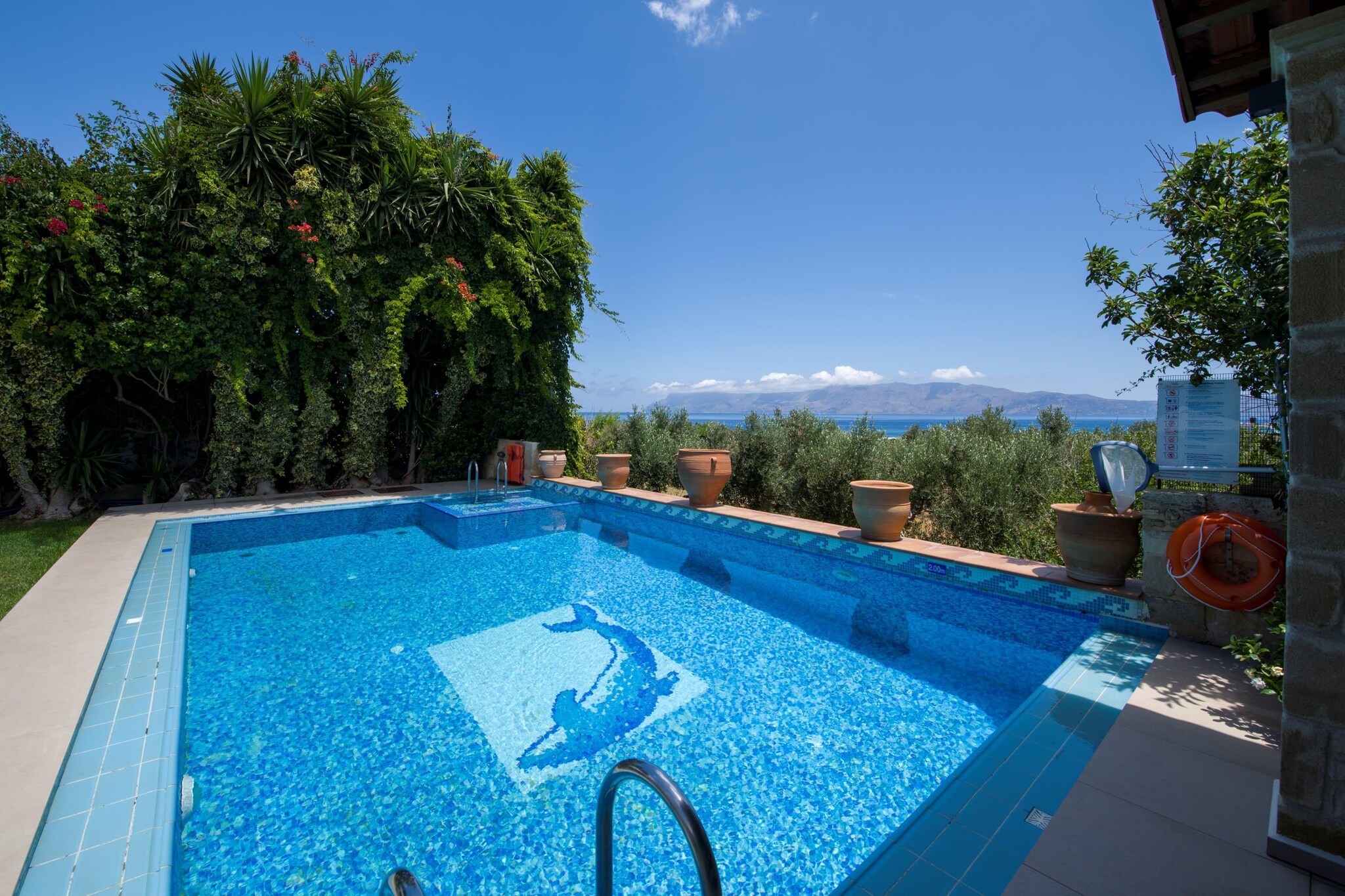 Imagine a place where lemon trees, bougainvillea and sea breeze meet stone walls, wooden ceilings, and a private pool under the open sky - that’s the feel of Villa Arhontariki at Kissamos Luxury Villas. Nestled in the peaceful village of Kalyviani, this place invites a group of friends or a big family to share a blend of comfort, space and Crete’s timeless charm.

When you step inside, you’ll find a warm, inviting home carefully furnished, where every room flows into shared spaces that encourage togetherness. Villa Arhontariki is spacious enough to comfortably accommodate up to 5 guests in two bedrooms with a double bed and one with a single bed, and three full bathrooms. On the ground floor, there’s a fully equipped kitchen, a spacious living room with a fireplace and a large wooden dining table - ideal for group meals and relaxed evenings, a cozy game room and a fitness corner next to the garden and pool area. Outside, a heated swimming pool and a well-tended garden with shaded seating areas invite you for poolside lunches or sunset drinks under the Cretan sky. Additional amenities include a TV, WiFi, Barbecue, sun loungers and on-site parking.

From here, you’re just a short drive from Kissamos town and its port. Local tavernas, small markets and beautiful beaches are close by - perfect for spontaneous trips to the sea or seaside dinners after a day of exploring. 

Villa Arhontariki is more than a place to stay; it’s a warm, spacious home where you can cook together, laugh around the table, swim under the stars, and explore Crete’s western coast with ease.
