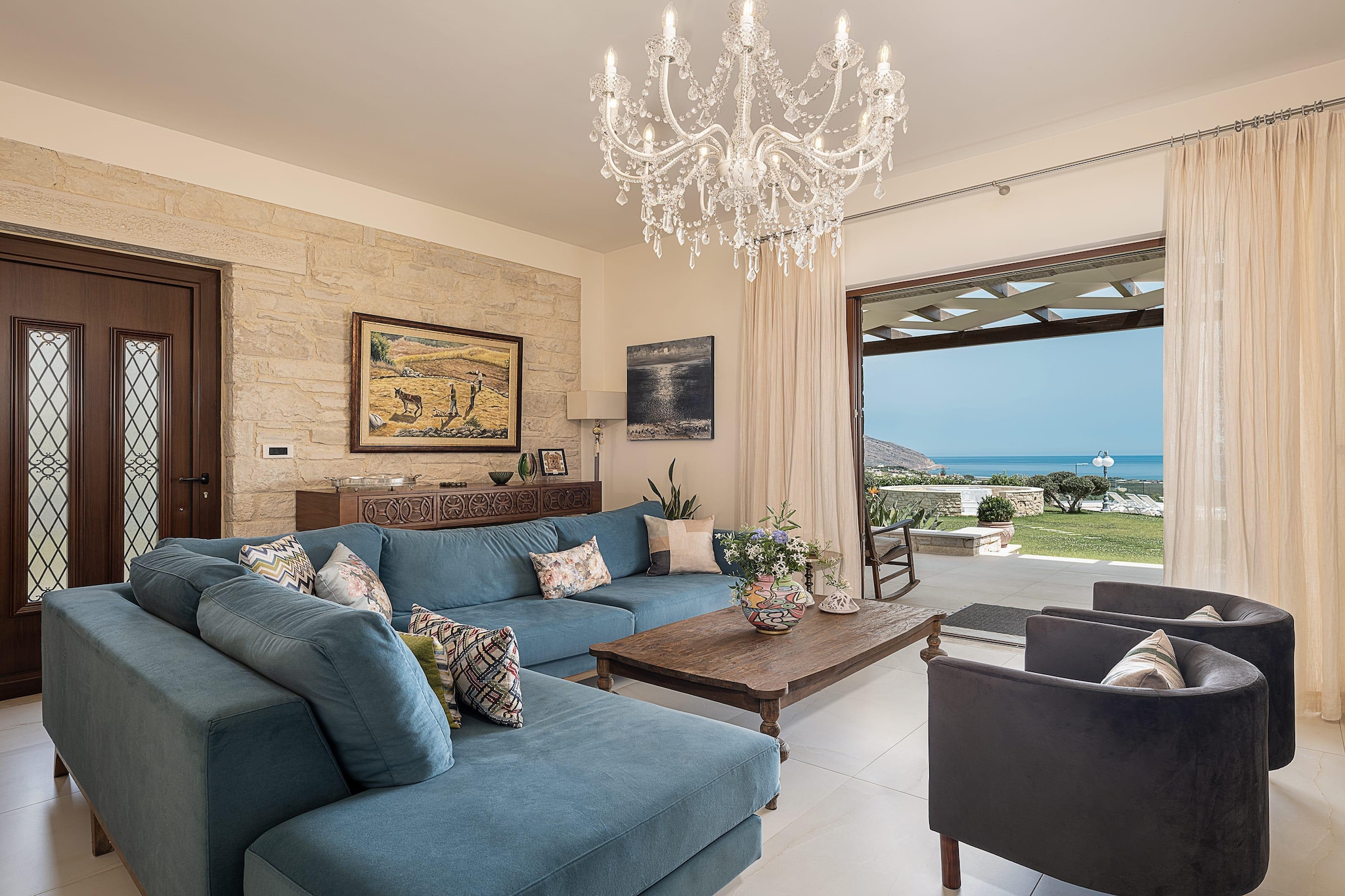 Think about arriving at a quiet lane of olive trees, stone walls and smiling Cretan warmth. This villa sits just outside a small village near the sleepy town of Kissamos - a peaceful stay where sea-breeze, rugged coastline and quiet nights set the tone for a getaway that’s relaxed, real and full of possibilities.

Stepping into the villa, you’re welcomed by spacious interiors where comfort meets elegance. The layout includes four cozy bedrooms – three with double beds each and one with a single bed, and three bathrooms, set for up to 7 guests. Every room is designed to feel natural and modest, with stone and wood details, soft lighting. A bright living area merges with a modern kitchen - equipped and ready for home-cooked meals.

Outside, the villa unfolds several amenities, a private infinity pool overlooking greenery and the distant sea, perfect for slow mornings with coffee or lazy afternoons. A sun terrace and garden space give you spots to lounge, read, share meals, or watch stars after dinner.

When you’re ready to explore, the western coast of Crete opens up for you many options - Golden-sand beaches, hidden coves and blue waters - from relaxed sunbathing to snorkelling and boat rides, all within minutes’ reach. Local tavernas, sea-facing lunches, fresh seafood and coastal walks bring a slower, richer rhythm to your days.

Villa Aloni is a quiet slice of Crete where people gather, sea and sky become the backdrop, and memories are made between sunlight, olive trees and soft sea breeze.