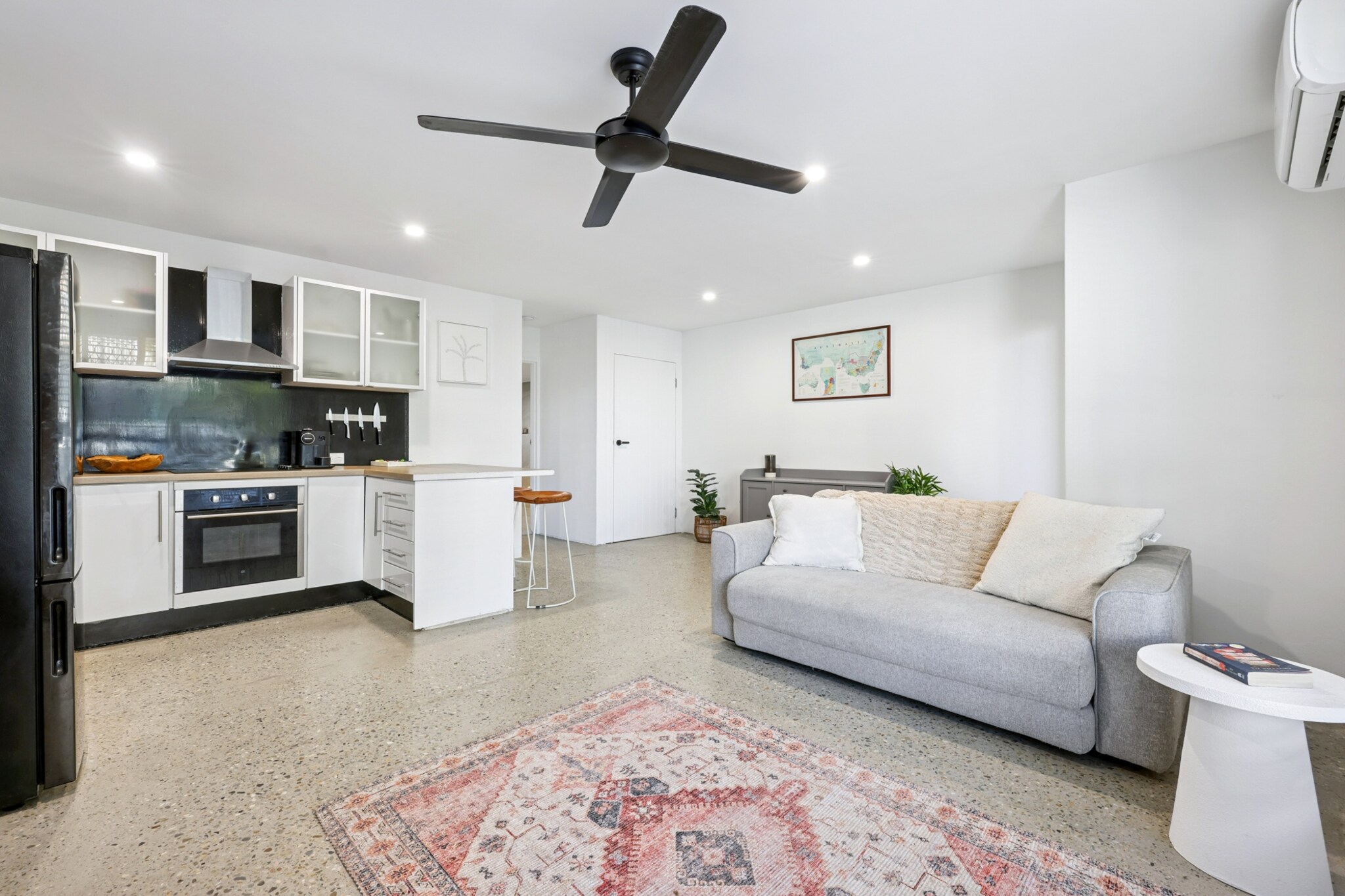 Property description
Located in the heart of Coolangatta, this spacious 1-bedroom apartment offers a perfect retreat for a relaxed stay. Enjoy the comfort of keyless entry, air conditioning, and access to a communal courtyard with BBQ facilities. The apartment is equipped with modern essentials including a well-appointed kitchen and private laundry. Enjoy easy access to local attractions, just a short walk to the beach and cafés.
The space
Step into a cosy living area with a contemporary feel, where the open plan design seamlessly integrates comfort and functionality. The living room is furnished with a two-seater sofa, perfect for unwinding after a day at the beach. Enjoy your favourite shows on the wall-mounted TV, or prepare a delicious meal in the fully equipped kitchen.
The bedroom is spacious, featuring a king-sized bed, ceiling fan, and ample wardrobe space. The bathroom is simple yet functional, offering a shower, toilet, and small bathroom bins.
Step outside to the communal courtyard, where you can enjoy outdoor meals and relax in the sunshine. A BBQ area is available for guest use, and the unit has easy access to a secure undercover parking spot.