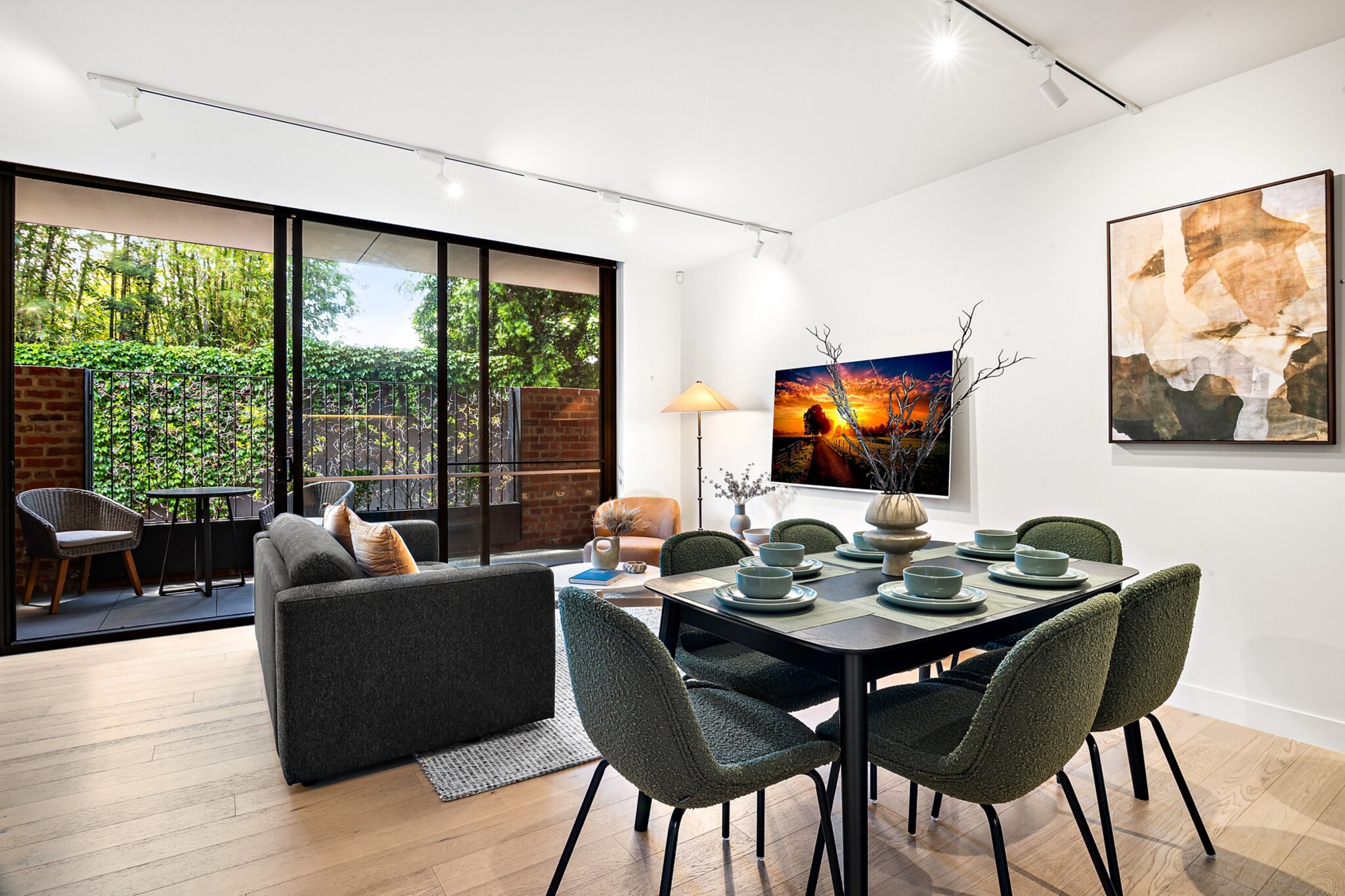 Property description
Experience the best of Fitzroy from this modern, two-storey townhouse featuring brand-new furnishings, two balconies, and a peaceful study nook. With garage parking and seamless KeyNest check-in, it’s the ideal base for exploring Melbourne’s artistic inner north. Whether you’re in town for work or leisure, this light-filled home promises both style and comfort.
The space
This architecturally designed townhouse welcomes you with contemporary finishes and thoughtfully curated interiors. The spacious open-plan living area is anchored by a plush two-seater couch and armchair, framed by warm wooden floors and stylish decor. A sleek dining area flows into the fully equipped kitchen, complete with modern appliances, ample cookware, and a breakfast counter with bar stools.
Upstairs, three versatile bedrooms offer restful sanctuaries, including a master with two single beds joined to form a king and blackout blinds throughout for an uninterrupted sleep. A dedicated study nook provides a serene workspace for remote workers or readers. The home features two pristine bathrooms, one with a bathtub perfect for a relaxing soak.
Enjoy alfresco moments on either of the private balconies or unwind in the leafy courtyard accessed from the living area. With central heating and fans throughout, every season is covered. Brand-new furniture and elegant finishes throughout make this a standout Fitzroy stay.
