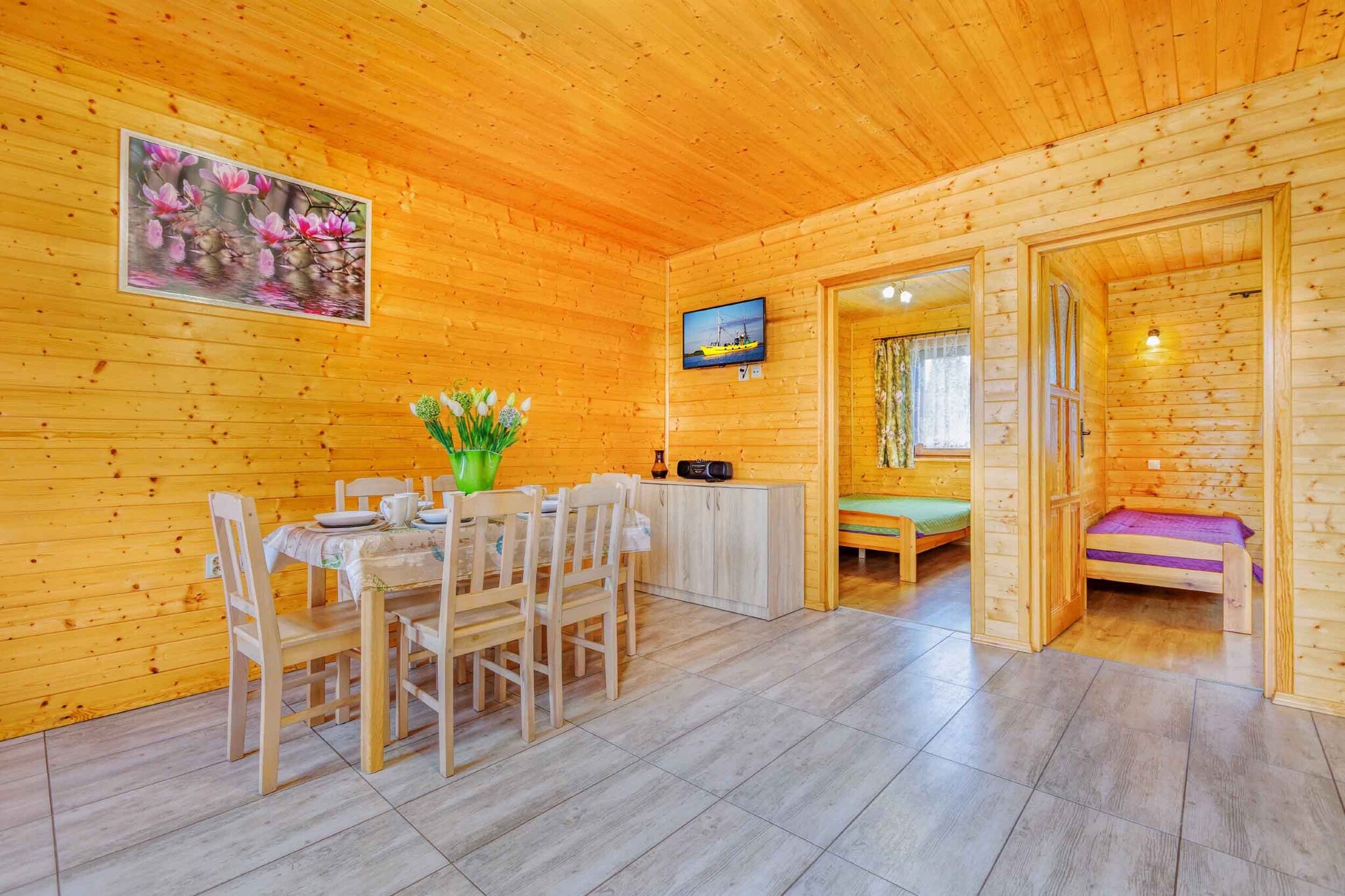 Two-story Brda-style holiday cottages. Accommodation for up to 5 people is available for an additional fee.

On the ground floor:

a living room with a kitchenette (fully equipped),
a sofa bed,
a bathroom with a shower,
a TV.

On the first floor:

an open-plan bedroom with a double bed and a single bed,
child safety gates on the stairs.

The cottage also includes two screens, two deckchairs, and an ironing board.

A barbecue and garden furniture are provided in front of the cottage.

Karwia offers a variety of accommodation options, ideal for families, couples, and groups of friends. Our accommodations include comfortable rooms, spacious apartments, and charming holiday cottages, all located within close proximity to the beach, forests, and other tourist attractions.

Whether you're planning a short weekend getaway or a longer vacation, our accommodations in Karwia will ensure a comfortable stay and unforgettable memories of your seaside vacation.