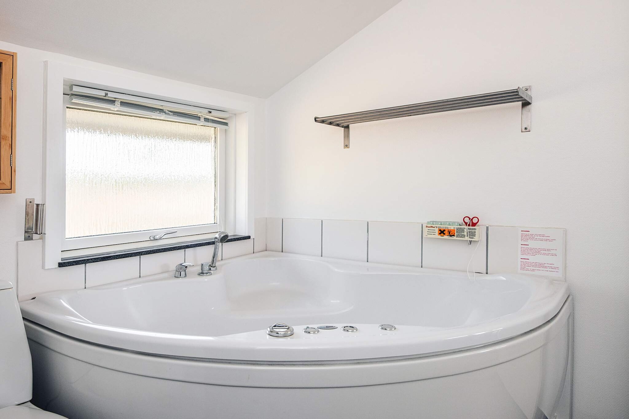 This attractive and newly renovated holiday home is located at the end of a quiet cul-de-sac on a large, hilly natural plot, where you can enjoy the peace and the relaxed holiday atmosphere. Indoors, the house appears bright and inviting with an open connection between the kitchen and the living room, creating a natural gathering place during your stay. The wood-burning stove adds extra coziness on cooler days, while the heat pump ensures a comfortable temperature all year round. The living room also features a Smart TV. The holiday home has three bedrooms as well as a bathroom with a whirlpool and sauna – perfect for relaxing after an active day in nature or at the beach. From the living room there is direct access to the large wooden terrace, which is ideal for outdoor living. There is plenty of space for sunbathing, dining under the open sky, and cozy evenings. The hilly plot invites play, relaxation, and nature experiences right outside the door. Here you will find a welcoming holiday home that is also close to everything you need for a great holiday.A refundable deposit might be charged closer to your check-in date. The security deposit ensures a smooth stay and covers any additional services or consumption charges.This deposit covers utilities consumed during your stay and any additional services that may be taken.The final amount will be adjusted based on actual meter readings, actual usage of extra services, and any remaining balance will be refunded within 21 days after checkout.This deposit simply acts as a prepayment for charges that you would anyways pay for, ensuring a seamless stay and check-out experience.
