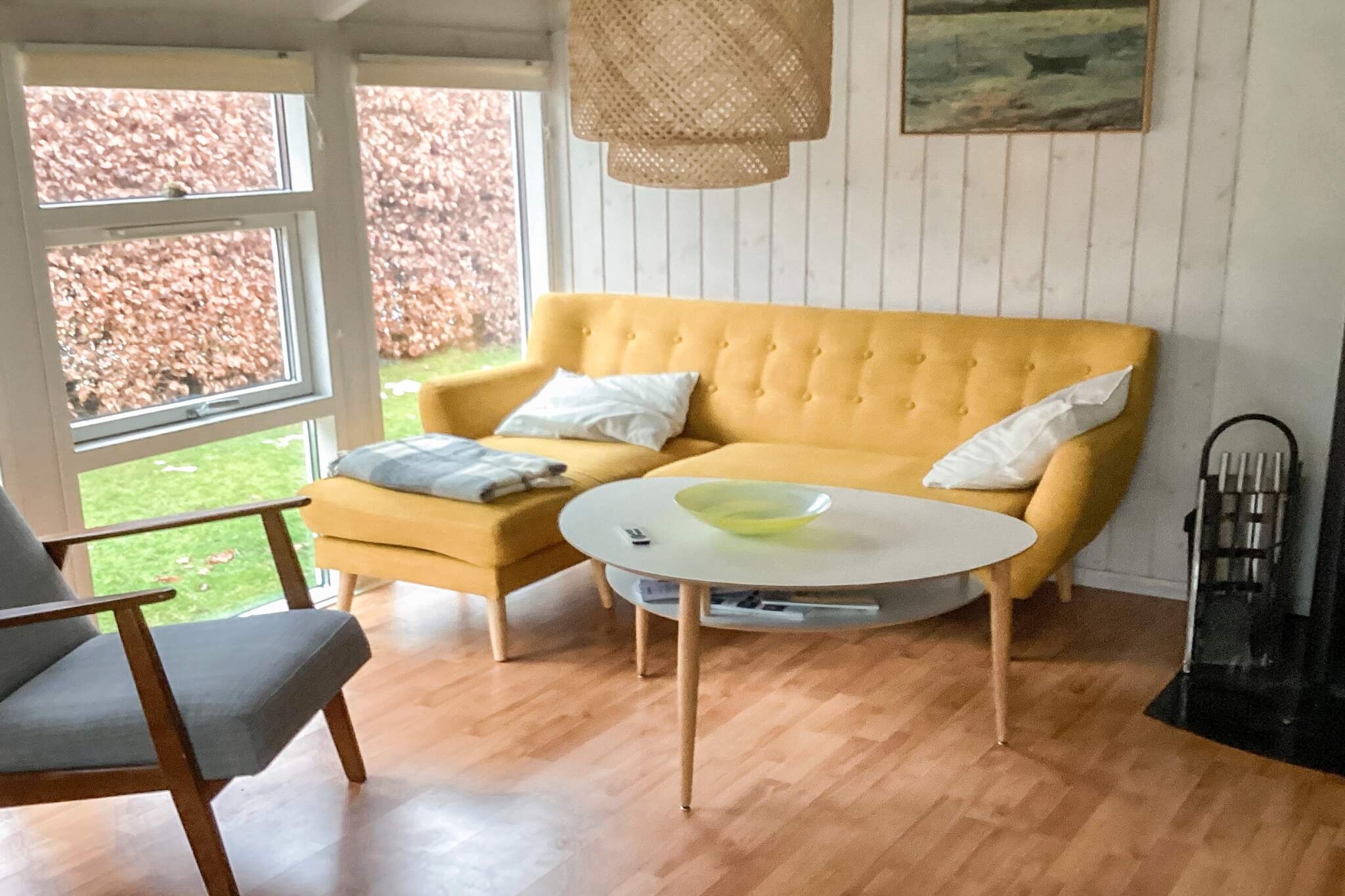 This cosy holiday home for four people offers a relaxing setting close to both nature and city life. The house has a bright bathroom with toilet, washbasin and shower, as well as two spacious bedrooms, both furnished with double beds. There is also a loft. The well-equipped kitchen has a fridge/freezer, stove and dishwasher, and is open to the living room. Here you will find a dining table, a cosy sofa arrangement, TV, Apple TV and a warming wood-burning stove, making the house ideal for stays all year round. The living room opens onto a 25 m² conservatory with large sliding doors that can be opened completely to transform the room into an inviting terrace on sunny days. The holiday home is located in a quiet, enclosed area with few neighbours and only 300 metres from the water, providing easy access to the beach and nature. At the same time, it is a short distance to the town, shops, restaurants and a nearby golf course – perfect for both relaxation and activities.A refundable deposit might be charged closer to your check-in date. The security deposit ensures a smooth stay and covers any additional services or consumption charges.This deposit covers utilities consumed during your stay and any additional services that may be taken.The final amount will be adjusted based on actual meter readings, actual usage of extra services, and any remaining balance will be refunded within 21 days after checkout.This deposit simply acts as a prepayment for charges that  you would anyways pay for, ensuring a seamless stay and check-out experience.
