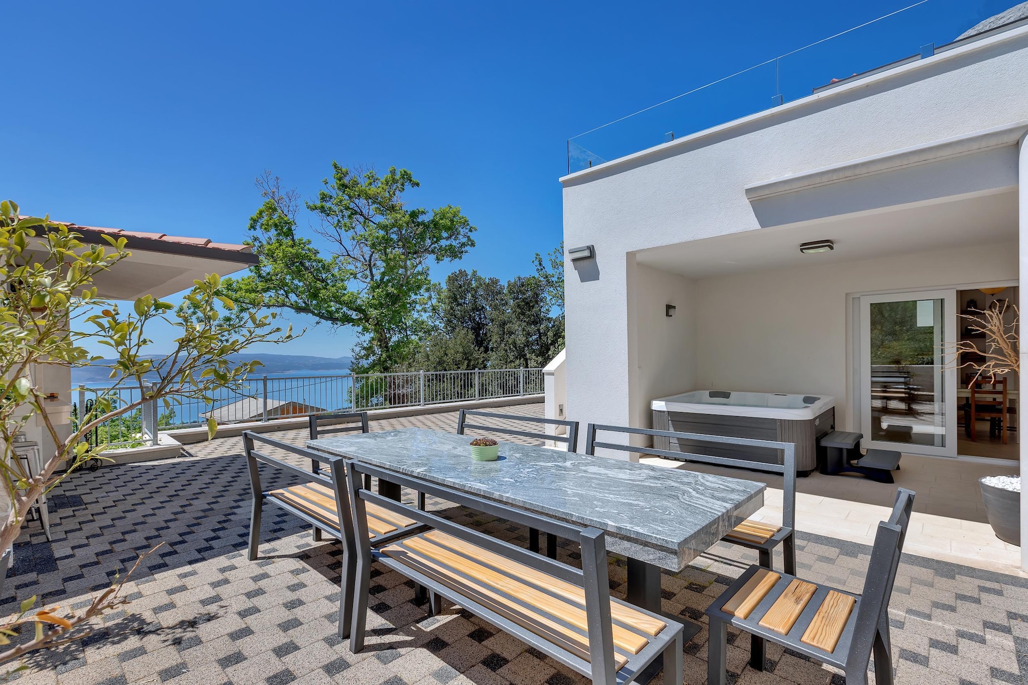 When festival plans stretch past sunset and the group chat never really quiets down, Villa Prestige sets the right stage for it all. Set above the coastal buzz of Baška Voda, with the Makarska Riviera unfolding nearby and Mt. Biokovo rising behind you, this 450 m², three-level villa for 10 guests is built for momentum, regrouping, and lively nights done right.

The lower-level works as your pre-game base - rustic tavern dining space, full kitchen, guest bedroom with en-suite, a separate toilet, and direct access to the Mediterranean garden and barbecue zone. One level up, the villa opens into its social heart - a large living room with enough seating, a dining table, a second fully equipped kitchen, plus a heated private pool, massage jets, outdoor shower, and panoramic sea views. A fitness room, sauna, and spa bathroom keep the balance between high output and fast recovery.

The top floor stays strictly for reset mode. Four sea-view bedrooms, all with en-suite bathrooms and balconies or terraces, keep privacy intact even with a full house. Hydro-massage tubs, walk-in showers, and air-conditioned comfort make mornings manageable after late nights.

Restaurants and bars sit within walking distance, while the nightlife, beach clubs, and festival energy of Makarska and the wider Riviera stay within easy reach. When the group needs a full-scale city switch-up, Split delivers rooftop bars, clubs, and sunrise ferry runs.

Villa Prestige is made for groups who want a luxury base with spa recovery, full-scale social space, private pool nights, and fast access to festival crowds - without giving up space, privacy, or post-party comfort.