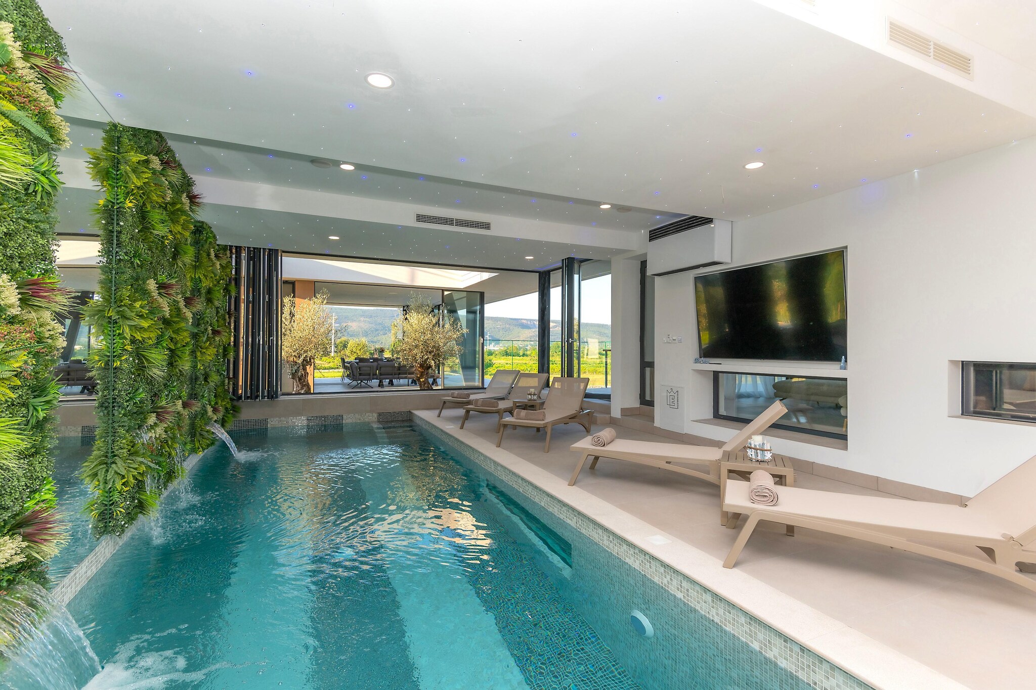 Set on a vast 3,800 m² private estate near Imotski, Villa Excelsior is built for moments that bring generations together - birthdays, anniversaries, reunions, and once-in-a-lifetime family gatherings. With space for up to 20 guests across 8 double bedrooms and multiple living zones, this is not just a villa, but a full private retreat designed for shared memories without stress.

Indoors, the villa unfolds into a huge kitchen, a generous living area, and a gathering room - ideal for game nights or formal family dinners. The glass-enclosed heated pool blends indoor comfort with outdoor openness, while the gym and sauna allow adults to unwind between celebrations. Balconies with peaceful countryside views create breathing room even at full capacity.

Outside, the property becomes a private resort. Children can freely move around indoors and a huge fenced garden outside, while adults gravitate toward the summer kitchen, shaded lounge, and large wood-fired barbecue. The rooftop jacuzzi, overlooking Imotski and the dramatic Blue Lake and Red Lake, becomes the natural evening gathering point.

Daily essentials, cafés, and restaurants sit close by, while beaches and the Adriatic coast are an easy day trip. A cultural escape to Split adds history and seaside promenades to longer stays.

Villa Excelsior is best suited for families who want one place for everyone - where kids play freely, adults relax properly, and celebrations happen without compromise, crowding, or schedules.