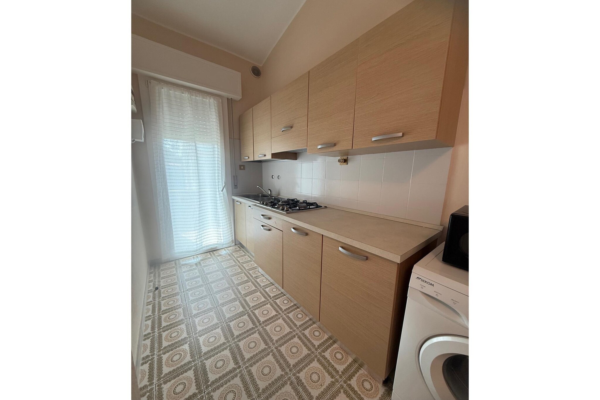 These recently renovated three-room apartments (trilocali) offer a comfortable and flexible setting for a seaside holiday, perfectly located just 250 meters from the seafront on Via Trieste. Each flat is designed with a combined living room and kitchen, providing a central, bright space for socializing and dining. The practical sleeping quarters include one dedicated double bedroom, and a second bedroom featuring a bunk bed along with an extractable single bed, making it highly flexible for families.

The apartments are fully equipped for a convenient, self-catered stay. Modern amenities include a TV, washing machine, microwave, and powerful air conditioning for a comfortable indoor climate. Guests benefit from a large common garden area and a dedicated parking space for each unit. Please note that to ensure maximum comfort for all residents, pets are not allowed at this property.

Beyond the 250m walk to the Rosolina Mare Beach, the location serves as an excellent base for exploring the area's natural and cultural highlights. The property is a gateway to the Po Delta Regional Park, offering opportunities for boat tours, birdwatching, and cycling. Just a short drive away is the Coastal Botanical Garden of Porto Caleri, a unique natural reserve with walking trails through pine forests and coastal lagoons. For culture and history, the charming town of Chioggia, often called "Little Venice," is easily reachable for a day trip. For connectivity, Wi-Fi access is typically available as a supplementary charge at a rate of €4 per night.