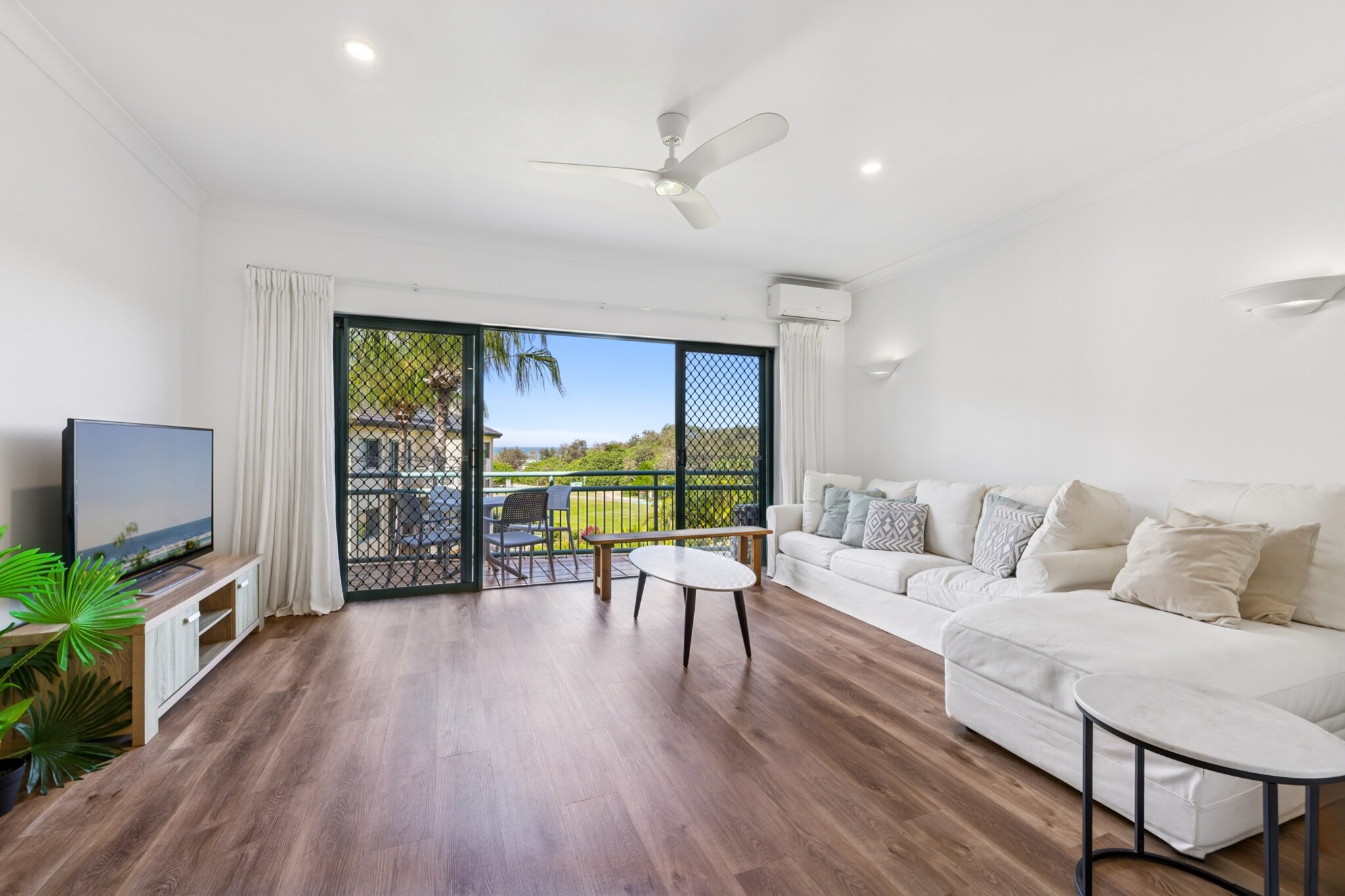 Property description
Located moments from the golden sands of Palm Beach, this inviting apartment offers a light-filled interior with a peaceful ambiance. Enjoy access to a pool, BBQ area, and onsite parking, all within a relaxed beachside setting. With self-check-in and coastal charm, this apartment is perfect for leisurely escapes or business stays alike.
The space
Step into a bright and breezy space thoughtfully designed for comfort and convenience. The open-plan living and dining area features a six-seater lounge and coffee table, framed by tasteful décor and artificial plants. A dining table with six chairs offers a cosy setting for shared meals, while the adjacent kitchen is well-equipped with an induction stovetop, dishwasher, microwave, and cooking essentials.
 
The apartment features two bedrooms—one with a queen bed and ensuite, the other with twin singles. Each bedroom includes bedside tables and lamps, with blackout blinds for restful sleep. While the bedroom with single beds has a blind that doesn't fully retract, the rooms remain airy and comfortable.
 
The modern bathrooms include essential amenities, and a private laundry setup (in the bathroom) includes a washing machine and dryer for guest use. Step outside to enjoy a balcony with a full outdoor furniture setting, or head downstairs to make use of the communal pool and BBQ area. This property combines laid-back beach living with thoughtful touches for a restful stay.