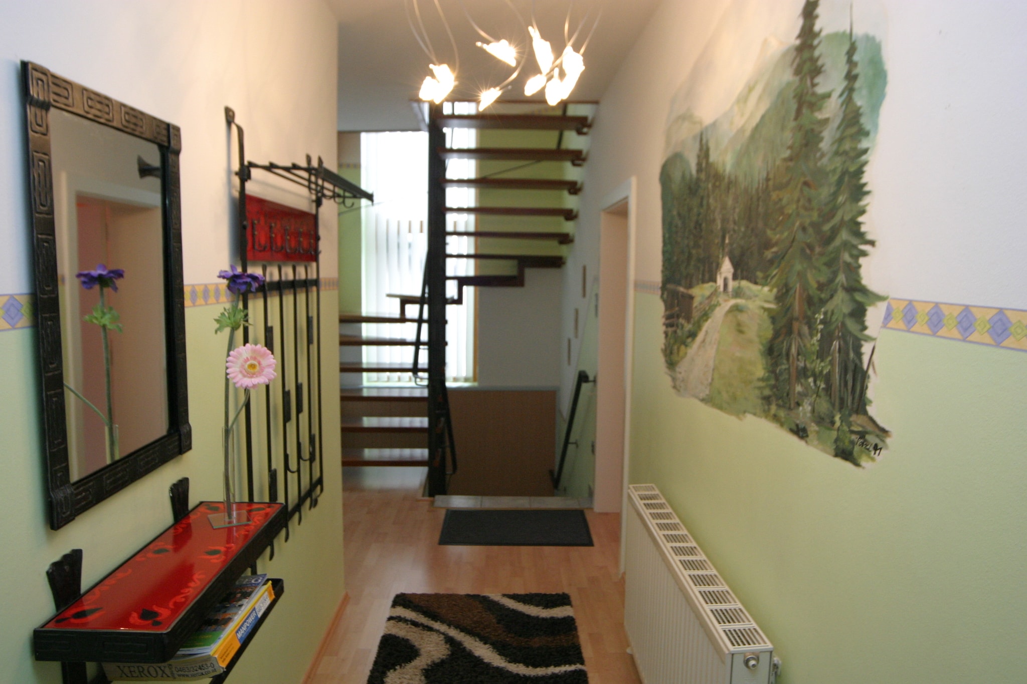 Ground floor: (Large kitchen(radio, wood cooker, coffee machine, oven, microwave, dishwasher, fridge-freezer), bedroom(2x double bed), bedroom(2x double bed), bathroom(shower), toilet)\n\nOn the 1st floor: (Living room(double sofa bed, TV(satellite), DVD player, radio, CD player), Kitchen(fridge-freezer), bedroom(double bed), bathroom(shower), toilet)\n\nBasement: (bedroom(double bed, radio), playroom(double sofa bed, TV(satellite), DVD player, radio, CD player), pantry(tumble dryer, washbasin, washing machine))\n\nplayroom, storage, double sofa bed, stove, balcony, heating(central), garden(fenced), garden furniture, BBQ, parking, sand pit, 2x children\'s bed, high chair