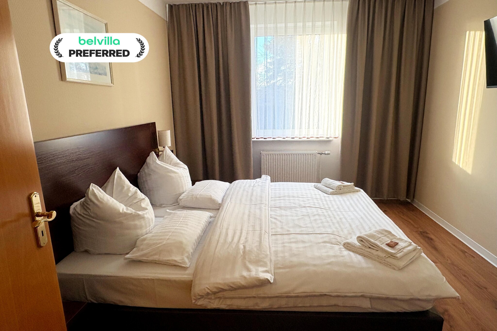 Surrounded by lakes, forest trails, and the fresh air of the state-approved Kneipp spa town of Feldberg, this wheelchair accessible double room at Kaiserhof Feldberg by Belvilla Resorts offers a stay designed around ease and calm. The hotel blends natural surroundings with thoughtful comfort, creating a welcoming environment where guests can slow down and enjoy independence without compromise. Ideal for travellers seeking accessibility, wellness, and quiet moments close to nature, this room makes relaxation feel effortless.
Wheelchair accessible double room features
1. Spacious living and sleeping area with a comfortable double bed
2. Barrier-free bathroom with walk-in shower, washbasin, toilet, and hairdryer
3. Flat-screen TV with cable and satellite channels, including Netflix
4. Comfortable seating area with ample space for easy movement
5. Free Wi-Fi and heating for year-round comfort
6. Step-free access via lift to all main hotel areas
7. Access to terrace and garden with sun loungers
8. Calm, non-smoking layout designed for accessibility
9. Pet-friendly (additional charge of 12 Euro/pet/night
Hotel amenities and facilities
1. Games and leisure options including billiards, darts, archery, mini golf, water sports, cycling, hiking, horse riding, fishing, and evening entertainment
2. Landscaped garden and sun terrace
3. On-site restaurant and bar
4. Paid parking Euros 5 per vehicle per day
5. Lift access throughout the hotel
6. Reception services from 6:00 to 11:00 in the morning and from 15:00 to 18:00 in the afternoon
7. Friendly guest suport
Nearby highlights
1. Feldberg Lake and town church within walking distance
2. Kneipp Spa Park approximately 150 m away
3. Forest trails and cycling routes across the Feldberg Lake District
How to reach
1. By car via regional roads with paid parking on site
2. By train to Neustrelitz or Neubrandenburg, followed by bus or taxi
3. By air via Heringsdorf Airport, about 117 km away
A comfortable, barrier-free stay where accessibility, nature, and relaxation come together naturally.