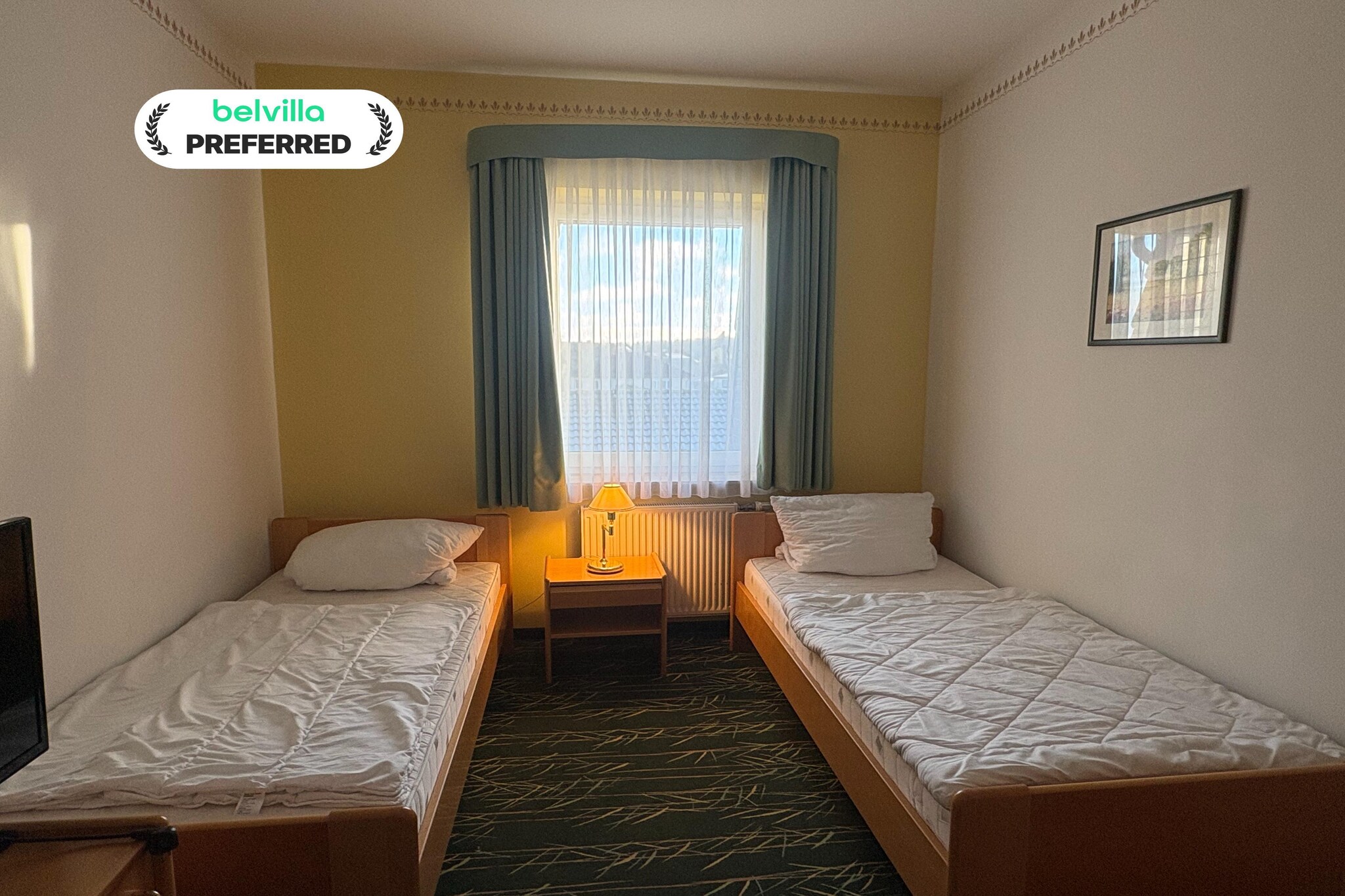 Situated in the heart of the Feldberg Lake District, this Standard Twin Room at Kaiserhof Feldberg by Belvilla Resorts offers a peaceful and comfortable base surrounded by lakes, forests, and fresh countryside air. Set in the state-approved Kneipp spa town of Feldberg, the hotel is ideal for guests seeking relaxation, nature, and easy access to walking paths and wellness-focused surroundings.
Standard Twin Room Features
1. Comfortable room with two single beds, ideal for friends or travel companions
2. Private bathroom with bathtub or shower, washbasin, toilet, and hairdryer
3. Flat-screen TV with cable and satellite channels, plus Netflix
4. Free Wi-Fi and a cozy seating area
5. Central heating for year-round comfort
6. Calm, non-smoking atmosphere with a practical layout
7. Access to garden areas, terrace spaces, and sun loungers
8. Designed for restful nights and relaxed days
9. Pet-friendly (additional charge of 12 Euro/pet/night)
Hotel Amenities & Guest Perks
1. Games and leisure options including billiards, darts, archery, mini golf, water sports, cycling, hiking, horse riding, fishing, and evening entertainment
2. Landscaped garden and outdoor relaxation areas
3. On-site restaurant and bar
4. Paid parking Euros 5 per vehicle per day
5. Lift access to all main areas
6. Reception available from 6:00 to 11:00 in the morning and from 15:00 to 18:00 in the afternoon
7. Attentive guest support
Nearby Attractions
1. Feldberg Lake and town church within walking distance
2. Kneipp Spa Park approx. 150 m away
3. Forest trails and cycling routes across the Feldberg Lake District
4. Schloss Tornow approx. 47 km
5. Neubrandenburg University of Applied Sciences approx. 35 km
How to Reach
1. By train: Neustrelitz or Neubrandenburg stations, followed by bus or taxi
2. By bus: Regular regional connections to Feldberg
3. By air: Heringsdorf Airport approx. 117 km away