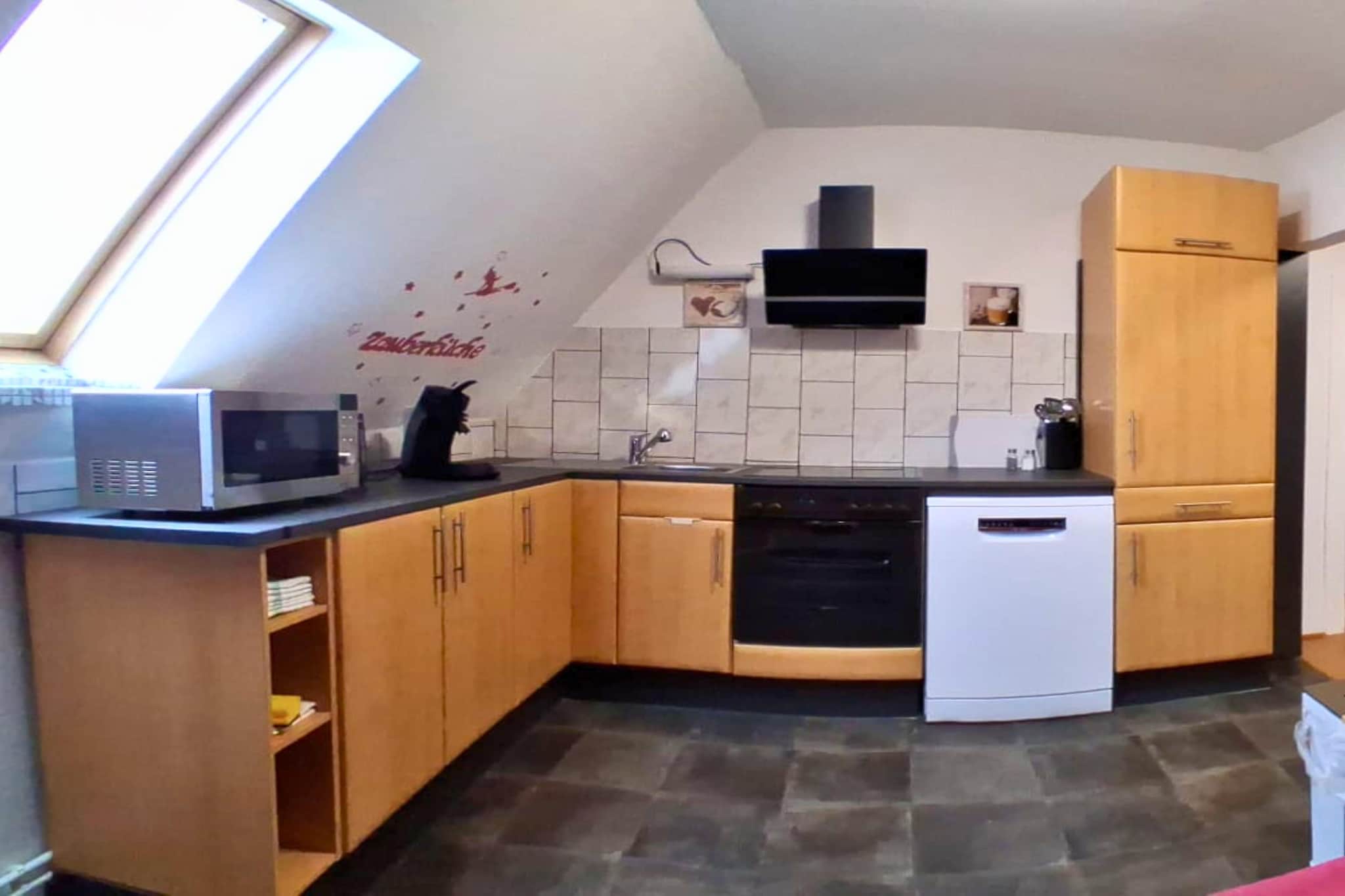 Ground floor: (bathroom(shower, washbasin, toilet, changing mat, hairdryer), toilet(washbasin, toilet), washing room(tumble dryer, washing machine), children\'s bed, high chair, toys)\n\nOn the 1st floor: (Living room(TV, seating area), dining room(dining table(6 persons)), Kitchen(dining table, electric kettle, toaster, cooker, hood, coffee machine, oven, microwave, dishwasher, fridge), bedroom(double bed), bedroom(single bed, single bed))\n\ngarden, garden furniture, BBQ, parking