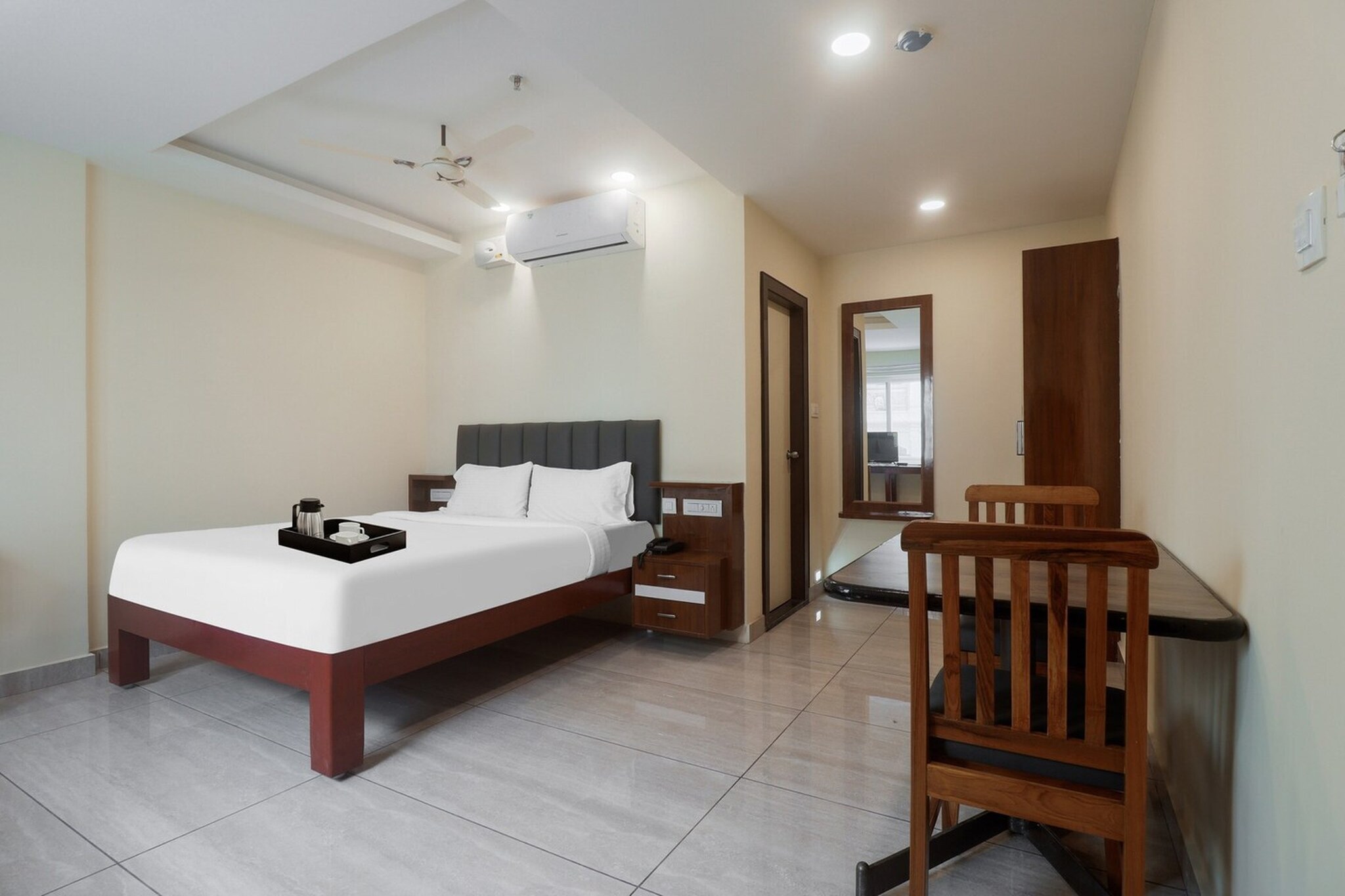 Comfortable Accommodations: Townhouse DJ Grand in Tirupati offers family rooms with air-conditioning, private bathrooms, and free WiFi. Each room includes a work desk, seating area, TV, and free toiletries. Dining Experience: The family-friendly restaurant serves Indian cuisine with halal and vegan options. Guests can enjoy lunch and dinner in a welcoming ambience. Convenient Facilities: The hotel features a lounge, lift, 24-hour front desk, shared kitchen, daily housekeeping, business area, babysitting, laundry, family rooms, room service, meeting rooms, tour desk, and luggage storage. Free on-site parking is available. Prime Location: Located 15 km from Tirupati Airport, the hotel is a 12-minute walk from APSRTC Central Bus Station and 1.2 km from Tirupati East Railway Station. Nearby attractions include ISKCON Temple (2.8 km) and Sri Kapileswara Swamy Temple (3 km).
Early Check-In Policy: A full day’s room rate will be charged for check-ins before 6:00 AM. Complimentary early check-in is available between 6:00 AM and 10:00 AM, subject to room availability.
Check-in is only available to guests aged 18 and above. Please provide a government-issued ID to confirm your age.