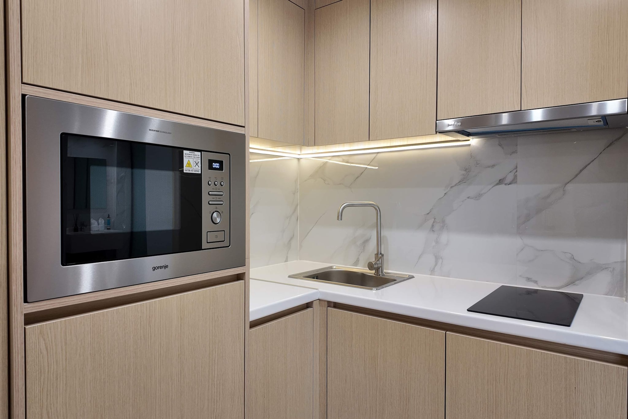 Nestled in the vibrant heart of Piraeus city centre, this recently renovated apartment offers a sophisticated urban escape where modern style meets maritime charm. Guests are welcomed into a bright, air-conditioned sanctuary that opens onto a private balcony featuring serene garden views. Whether you are enjoying a morning brew from the coffee machine on the sun terrace or unwinding amidst the lush greenery of the shared garden, the property provides a peaceful residential feel while keeping you connected with high-speed internet.
The interior is thoughtfully designed for two, featuring a cozy bedroom equipped with a double bed and a flatscreen cable TV for relaxing evenings. The functional kitchenette is fully prepared for your stay with a microwave, electric kettle, and a dining table perfect for intimate meals. For those who prioritize wellness, the building features a dedicated gym to maintain your fitness routine, while a modern bathroom stocked with fresh towels and a hairdryer ensures a seamless experience. Added conveniences like a lift, an on-site bar, and inclusive bed linens and sheets make this a truly effortless getaway.
Adventure lies just beyond your doorstep, as the apartment is perfectly positioned for exploring the Athenian coast. A short stroll leads you to the bustling Piraeus Port or the sun-soaked shores of Freatida Beach. The surrounding area is a gateway to the Aegean, with local boating opportunities and iconic landmarks like the Stavros Niarchos Foundation Cultural Center and Flisvos Marina just a short drive away. It is a place where city life and coastal beauty converge for a truly memorable stay.