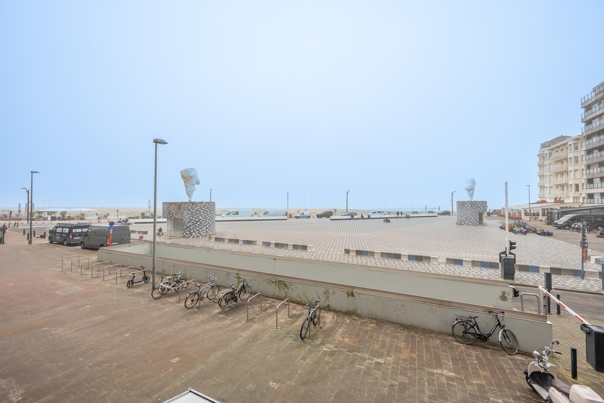 Tucked just beyond Albertstrand, where the North Sea breeze softens into a calming hush, this elegant apartment enjoys a prime position along Oostende’s vibrant waterfront. With wide, open sea views stretching before you, mornings begin slowly, afternoons invite unhurried seaside walks, and evenings settle into an easy coastal rhythm.

Designed comfortably for up to 4 guests, the apartment’s layout suits friends travelling together or couples sharing a getaway. There are two inviting bedrooms furnished with a double bed and two single beds, respectively, for flexible sleeping arrangements. The living room is bright and welcoming, filled with generous seating and large windows with balconies in two directions. The kitchen is well-equipped for relaxed breakfasts or simple evening meals, while the shared bathroom includes all daily essentials plus a separate shower room. A TV, Wi-Fi, parking and washing machine make longer stays convenient and effortless.

Oostende rewards those who explore it on foot. Within minutes, you can stroll along the Albert Promenade, enjoy performances at the Kursaal, visit the historic Mercator ship, or unwind in the leafy calm of Leopoldpark surrounded by cafés. The harbour and nearby streets are filled with inviting seafood restaurants, cozy bistros, and refined dining options waiting to be discovered.

Local shops and bakeries make morning errands a pleasure, while tram and train connections provide easy access to the wider city. The beach feels like an extension of your stay, just steps away whenever you wish. After sunset, return to the comfort of the apartment for quiet drinks, conversation, and the steady sound of the sea in the background.