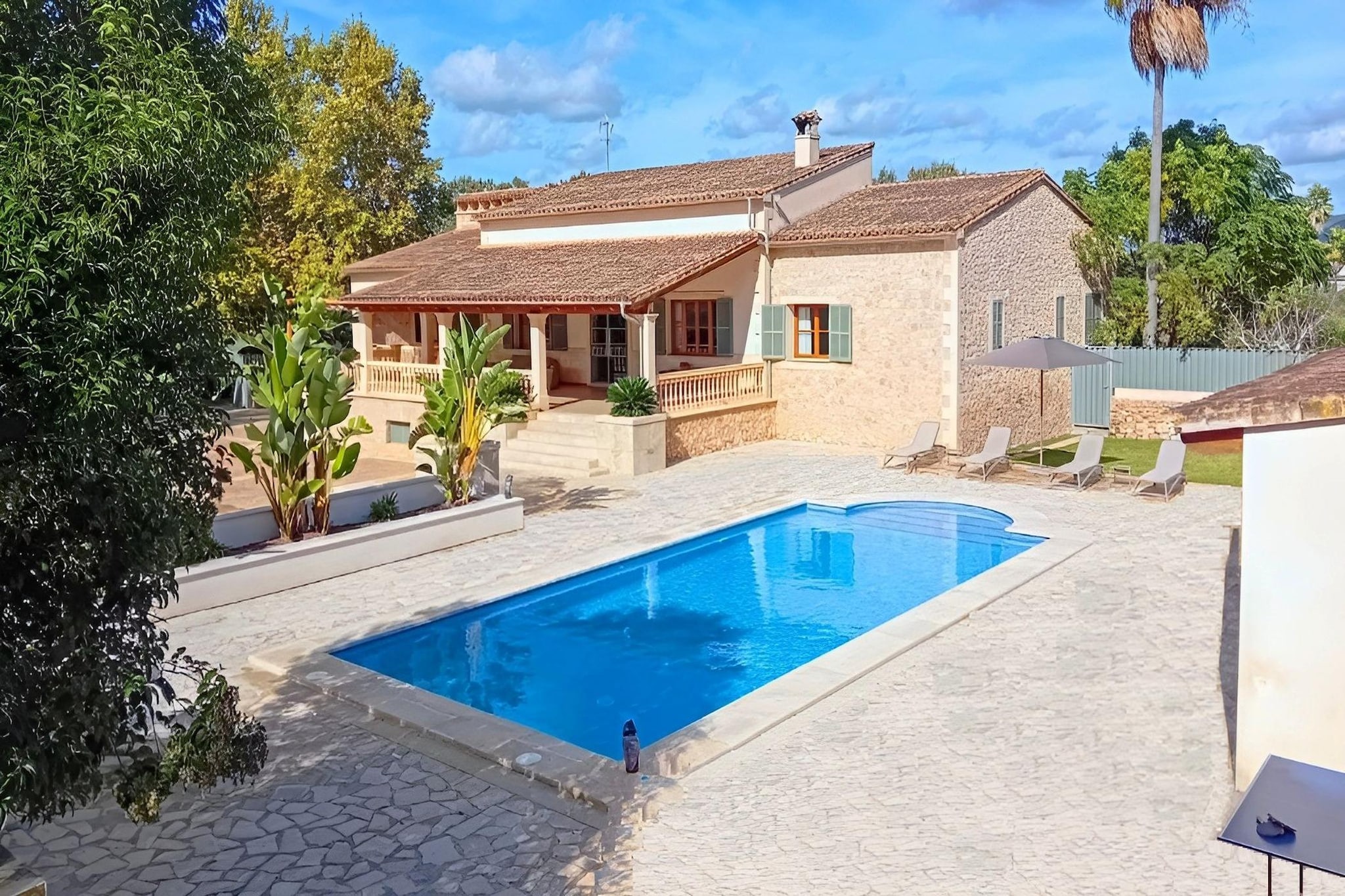 Tucked into the vibrant centre of Manacor, this detached holiday home offers space, privacy, and comfort for up to six guests - ideal for families or friends looking to unwind in a quiet, green setting while staying within easy reach of Mallorca’s coastline.

The ground floor centres around a welcoming living and dining area with a TV, comfortable seating, and a dining table for shared meals. The fully equipped kitchen includes a coffee machine, dishwasher, and fridge-freezer, making self-catering effortless. Two bedrooms with twin single beds are located on this level, along with modern shared bathrooms. The master suite features a double bed and a private bathroom with a bathtub, offering extra comfort and privacy.

Step outside and you’ll find the true highlight of the home: a generous 1,500 m² garden designed for slow, sunny days. The private swimming pool is surrounded by sun loungers, while the terrace with garden furniture, parasol, and BBQ area sets the scene for long outdoor lunches and relaxed evenings. Practical comforts include Wi-Fi, a washing machine, a tumble dryer, heating, parking, a cot, and a high chair. The property is also powered by solar energy, adding a thoughtful, eco-friendly touch to your stay.

From here, you can explore the authentic charm of inland Mallorca while being a short drive from beautiful coves such as Cala Varques and the island’s scenic eastern coastline across Mallorca.