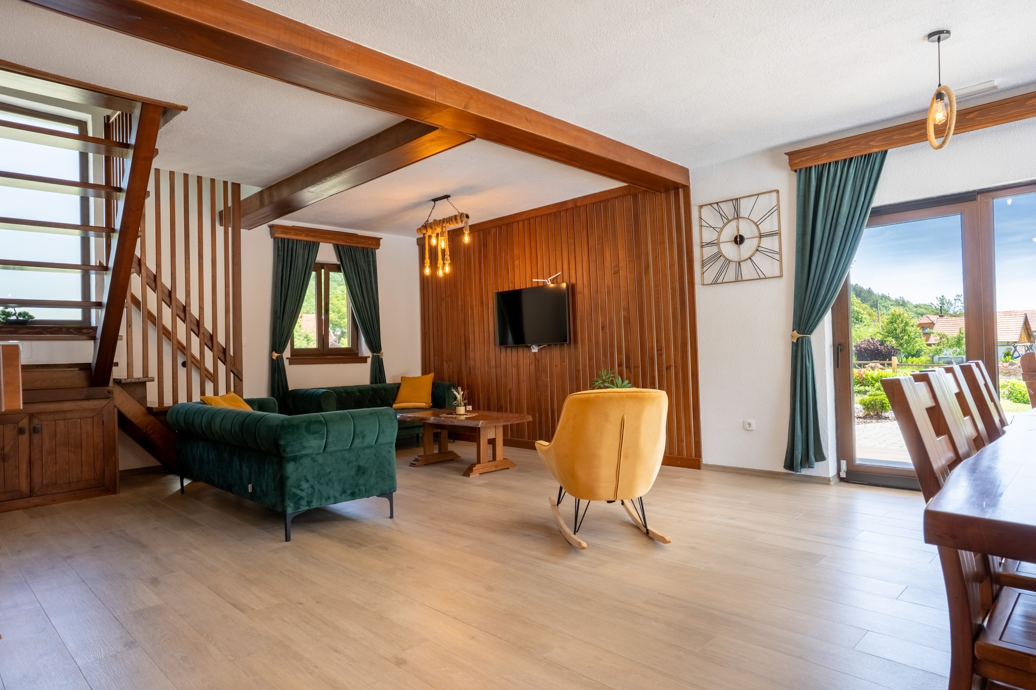 Ground floor: (Living room(TV, fireplace, seating area), dining room(dining table), Kitchen(coffee machine, oven, microwave, dishwasher, fridge, freezer, dishes and cutlery), bathroom(washbasin, toilet))\n\nOn the 1st floor: (Bedroom with bathroom(single bed, double bed, shower, washbasin, air conditioning), Bedroom with bathroom(single sofa bed, double bed, shower, washbasin, air conditioning), Bedroom with bathroom(single bed, single bed, single sofa bed, bath tub, washbasin), bathroom(bath tub, washbasin))\n\noutdoor kitchen, Garden Furniture , fireplace, sauna, washing machine, balcony, air conditioning, terrace, garden, sun loungers, parking, swimming pool(private, heated), slide, table football, darts, hairdryer, Volleyball court, Swing set, Mountain view