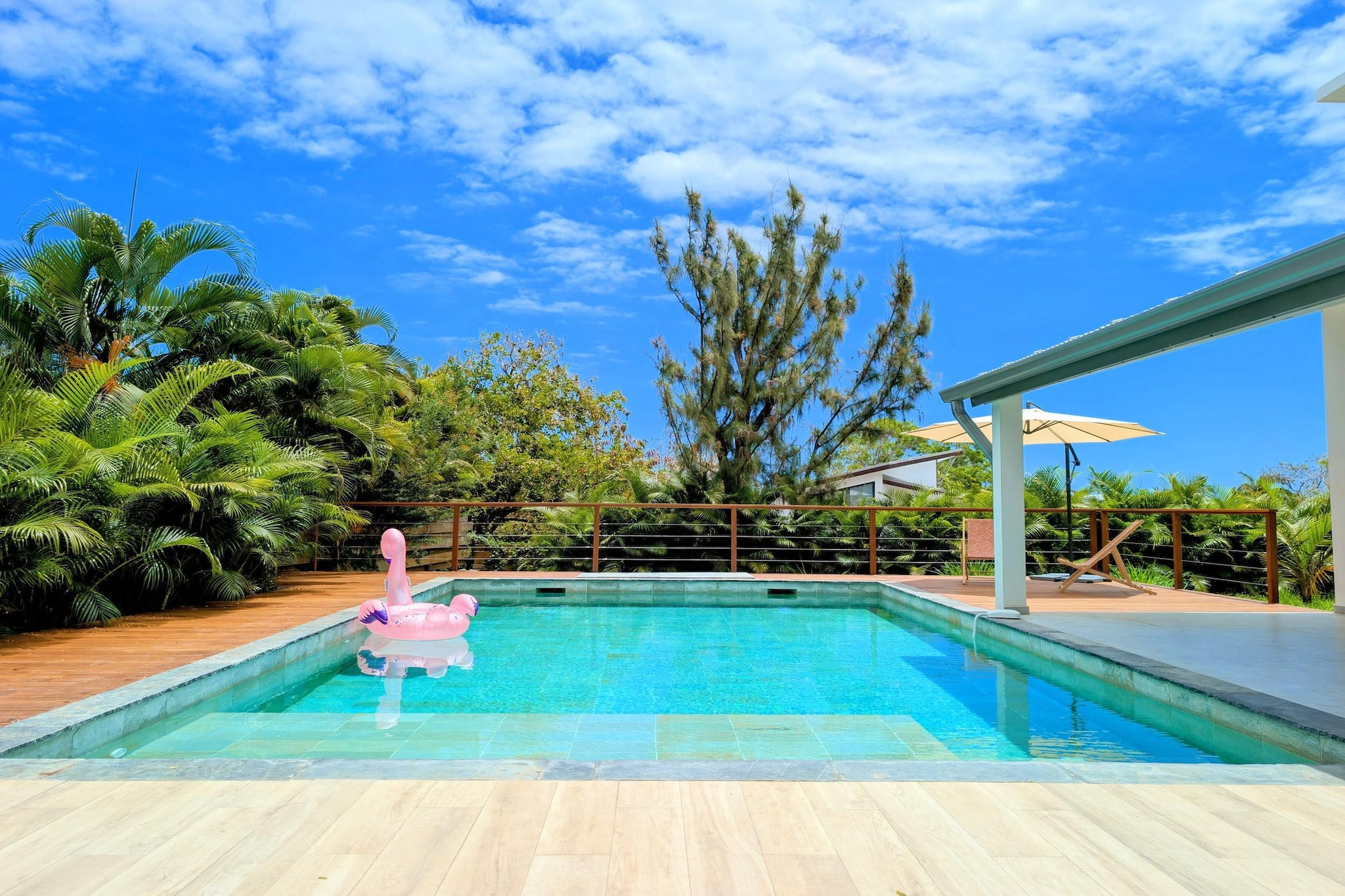 Sunshine, palm trees, and the turquoise lagoon set the scene for this spacious four-bedroom villa in La Saline le Bains, Saint-Paul. Designed for families or groups seeking comfort and privacy, the home blends tropical outdoor living with modern interiors - just moments from the island’s beautiful west coast beaches.

Inside, the bright living and dining area features comfortable seating, a TV, and a large dining table where everyone can gather for meals or relaxed evenings. The fully equipped kitchen comes with a coffee machine, microwave, dishwasher, and fridge-freezer, making self-catering effortless. The villa comfortably accommodates guests across four well-appointed bedrooms: one with a double bed, one with a king-sized double bed, another double bedroom, and a twin room with two single beds - ideal for children or friends sharing. Three modern bathrooms ensure convenience and privacy for the whole group. With air conditioning, internet access, washer-dryer facilities, and a cot available, every practical detail has been considered. 

Step outdoors and the atmosphere truly comes alive. A private swimming pool invites you to cool off under the island sun, while the garden, balcony, and furnished outdoor areas are perfect for long breakfasts, sunset drinks, or alfresco barbecues. Sun loungers, parking, and a peaceful setting complete the experience.

From lagoon swims and snorkelling adventures to hiking volcanic landscapes and exploring local markets, this villa offers a relaxed yet well-connected base for discovering the vibrant beauty of Réunion Island.