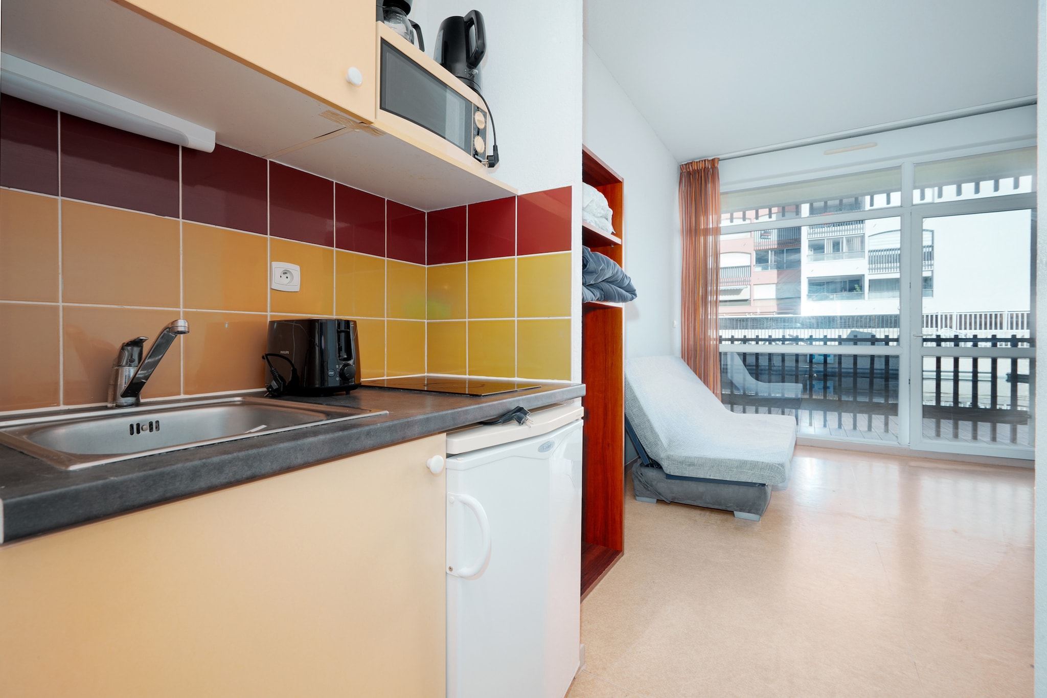 Elevator, Kitchen(electric kettle, toaster, coffee machine, microwave, fridge, dishes and cutlery), Living/bed room(double sofa bed, TV, dining table, seating area), bathroom(bath tub, washbasin, toilet), balcony, heating, swimming pool(shared with other guests, heated)