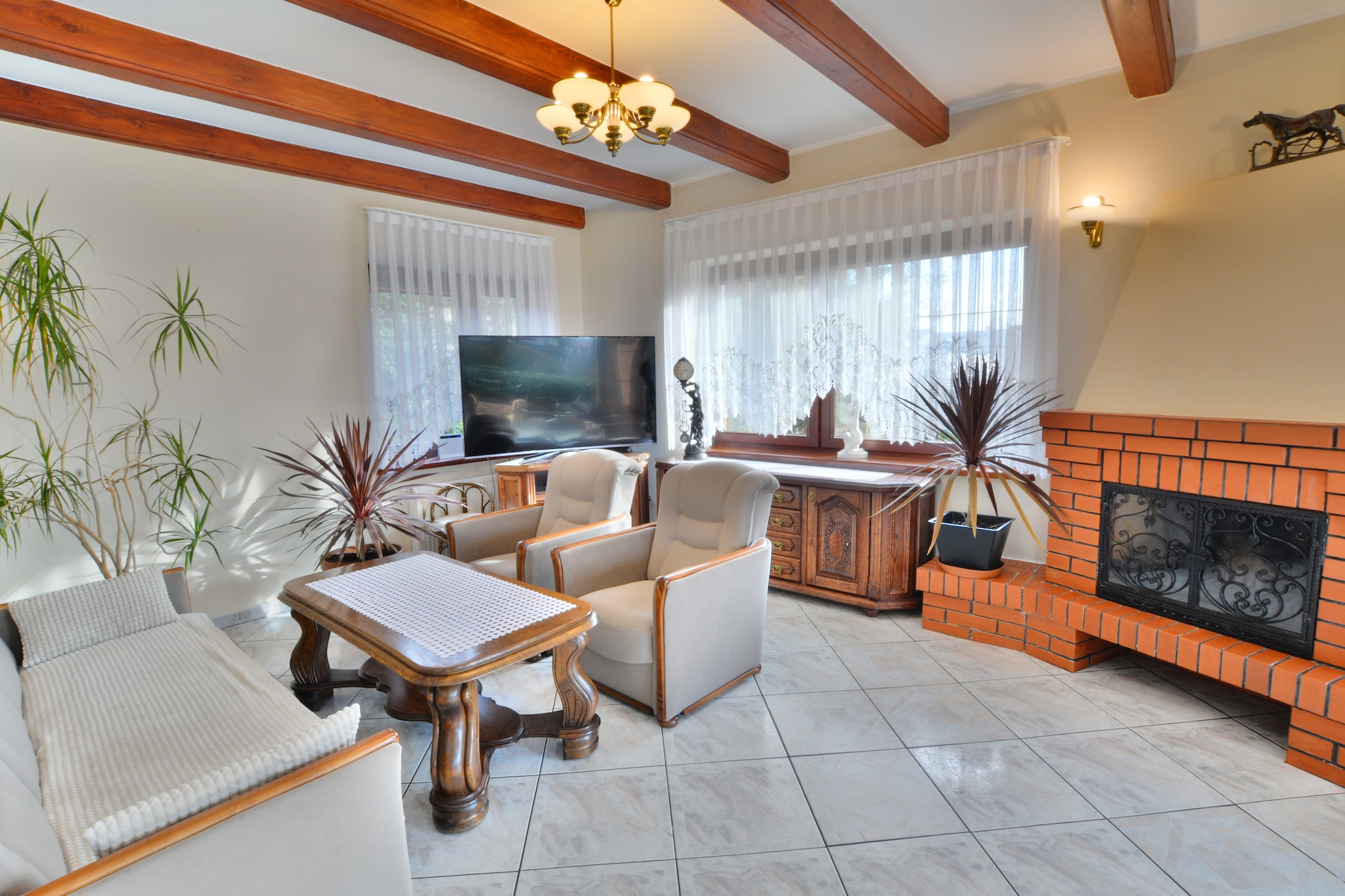 The comfortable holiday home has an excellent location, 70 m from the beach, in the centre of the resort. The house has a fenced area for private use, with parking for 3 cars and a well-kept garden. There are plenty of cafes, restaurants and shops around.
The beautifully furnished holiday home has 3 floors. On the ground floor there is a spacious and elegant living room with TV and a set of lounge furniture. From the living room there is an exit to the covered terrace and further to the well-kept garden with a pond. On the ground floor there is also a dining room with a large table and a very well-equipped kitchen. There is an additional, smaller table in the kitchen. On this floor there is also a 3-person sauna, shower and toilet. On the ground floor there is air conditioning. On the first floor there are 2 separate bedrooms (including 1 with a balcony and TV) and a bathroom with shower (there is a washing machine here). Steep stairs lead to the attic, where there is another, atmospheric bedroom with a seating area with a sofa and TV. Central heating.
Wireless internet and barbecue facilities are available. There is a secure parking lot (additionally paid) within the fenced property. For an additional fee, you can rent 4 bikes.

The owner of the property lives on the neighboring property. There is a small playground by his house, which can also be used by guests.

The price of your stay includes: bed linen, towels, water and electricity consumption (limit 20 kWh/day), heating, air conditioning, internet, cot and highchair.

Ustronie Morskie is located 10 km from Kołobrzeg. A sandy, clean beach, a walking pier, a seaside climate, a picturesque cliff are the advantages of this resort. Ustronie Morskie is a well-known and popular holiday resort on the Polish coast - many cultural and sports events are organized here. Active people, in addition to sunbathing and sea bathing, can take advantage of hiking and cycling trips, horse riding and sightseeing flights.