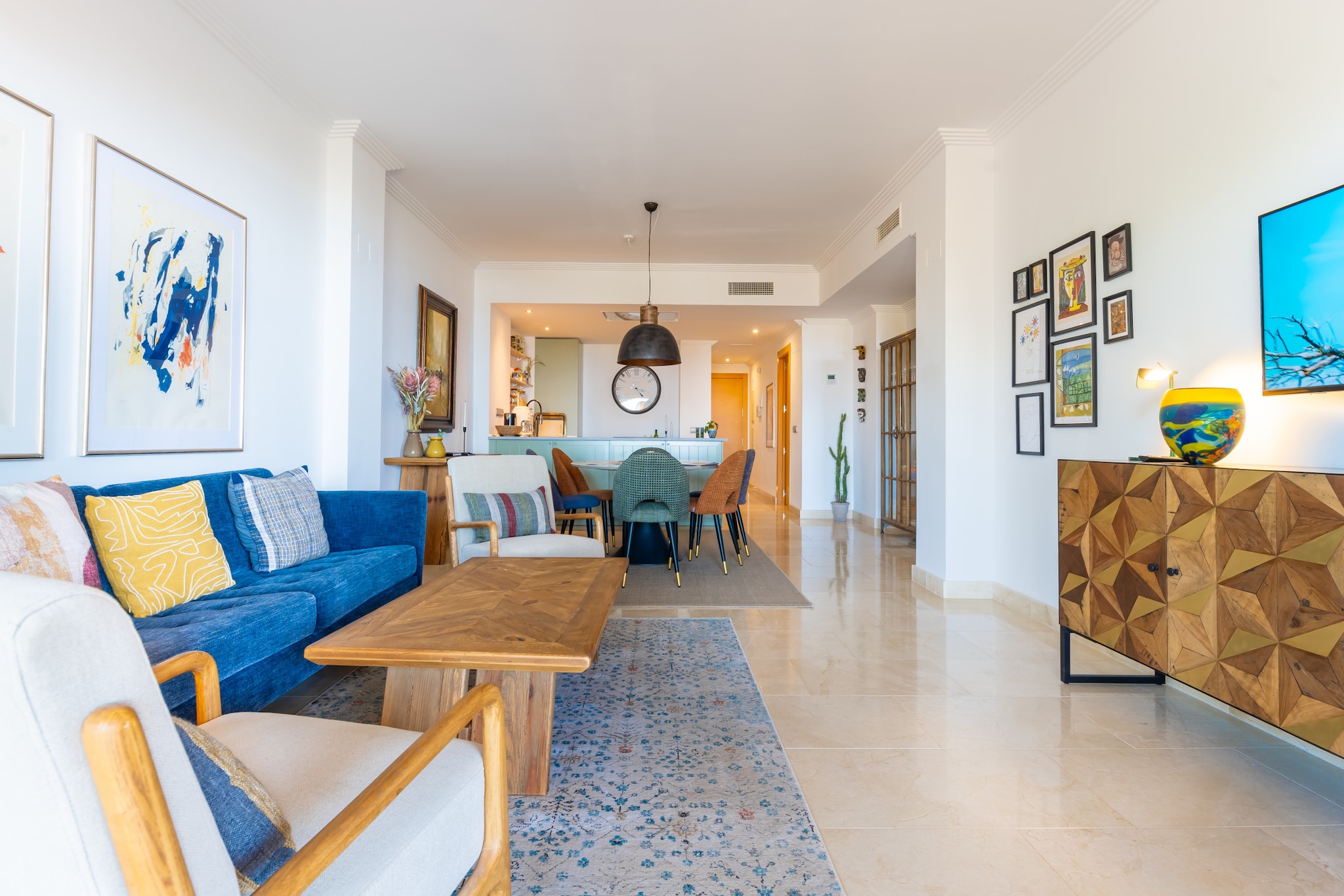 In the peaceful hills of Benahavís, this spacious apartment offers a comfortable stay for up to six guests seeking both relaxation and scenic surroundings. Positioned between Marbella and Estepona, the property provides a tranquil base while remaining within convenient driving distance of local beaches, golf courses and coastal amenities.

Inside, the apartment features three separate bedrooms arranged to suit flexible group accommodation, along with two bathrooms to support everyday convenience during shared stays. The bright living area includes comfortable seating and a television for relaxed evenings indoors following time spent outdoors. A fully equipped kitchen includes a refrigerator, oven, microwave and dishwasher, allowing guests to prepare meals with ease throughout their stay. A washing machine, air-conditioning and free WiFi are also available, helping ensure comfort and practicality throughout the year.

Floor-to-ceiling doors open onto a generous private terrace offering panoramic sea and mountain views, creating an inviting outdoor space for morning coffee or shared meals in the fresh Mediterranean air. Guests also benefit from access to landscaped communal gardens and a shared outdoor swimming pool within the residence, while free on-site parking and lift access simplify arrival and daily movement.

Situated just a short drive from Puerto Banús, Estepona Beach and several nearby golf courses, this apartment provides year-round opportunities for coastal walks, sightseeing and outdoor activities across southern Spain’s Andalusian coastline.