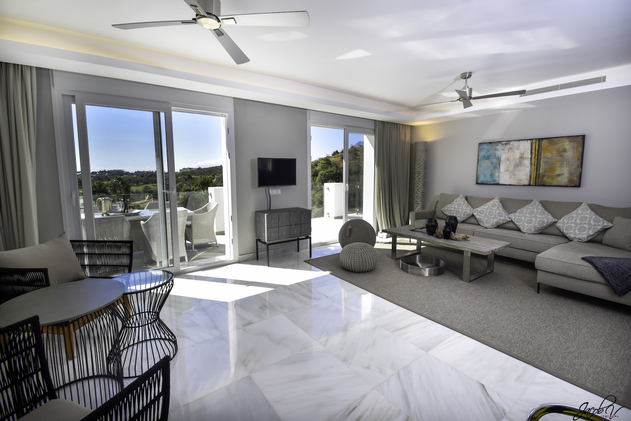 Perched in a peaceful residential enclave just a short drive from Marbella’s coastline, this stylish villa offers an inviting retreat for up to eight guests looking to blend coastal living with private relaxation on Spain’s Costa del Sol. With contemporary interiors, multiple terraces and scenic sea views, it’s an excellent choice for families or groups seeking a tranquil base close to beaches, golf, dining and cultural attractions.

Inside, the villa features four well-appointed bedrooms arranged for flexible group stays. The south-facing master suite includes a double bed, en-suite bathroom and balcony access, while the additional bedrooms are furnished with a mix of double and single beds to suit families and friends travelling together. Two additional bathrooms with toilets, support daily convenience, and the fully equipped kitchen makes meal preparation effortless throughout your stay. A washing machine and dryer are available for longer visits, and high-speed WiFi keeps you connected indoors. Air-conditioning and underfloor heating ensure comfort year-round.

Stepping outside, you’ll find a private heated swimming pool surrounded by sun loungers and landscaped gardens - an ideal spot for relaxation, socializing and soaking up the Mediterranean sunshine. Multiple terraces, including a covered outdoor dining area and a poolside barbecue, invite alfresco meals and sunset gatherings, while panoramic sea views offer a serene backdrop to your days.

Situated within driving distance of Marbella’s old town, beaches, beach clubs and scenic coastal walks, this tranquil villa provides year-round access to sun-soaked shores, golf courses and all that the Costa del Sol has to offer.