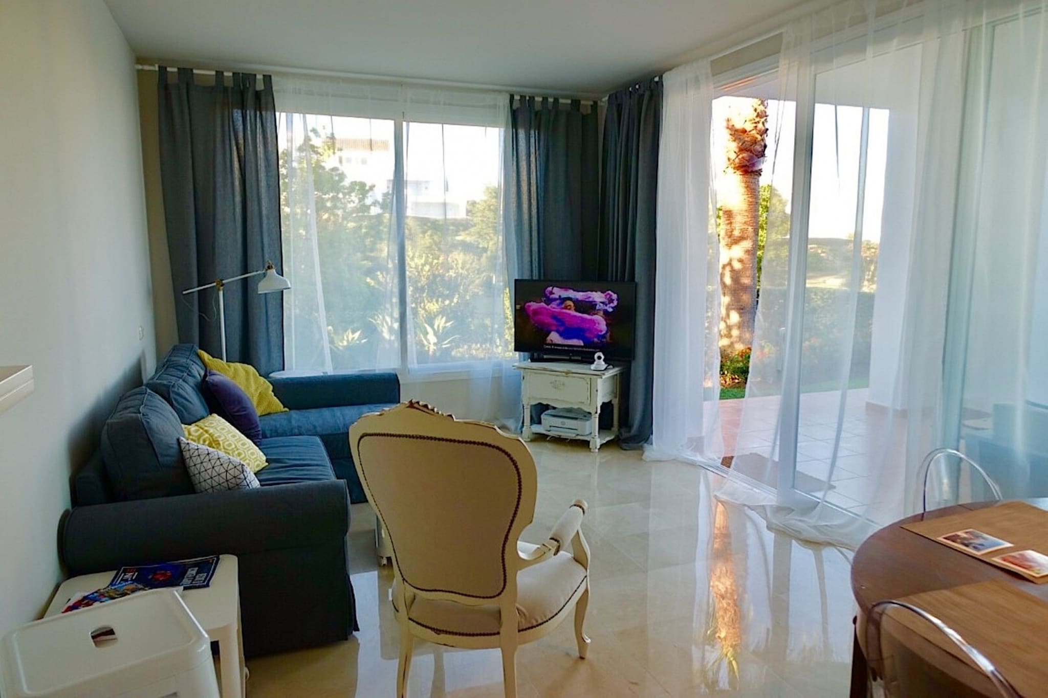 Set within the exclusive Alcazaba Lagoon residential resort near Casares in Spain’s Costa del Sol, this modern apartment offers relaxing accommodation for up to five guests in a serene, gated Mediterranean setting. Positioned just steps from the resort’s glittering crystal lagoon and communal pools, it’s an ideal choice for families or small groups seeking easy access to both natural beauty and coastal attractions along the Estepona coastline.

Inside, the bright living space creates a welcoming atmosphere with comfortable seating and dining for shared meals. The fully equipped kitchen makes self-catering simple throughout your stay. Two well-appointed bedrooms with a double, a single and a bunk bed provide flexible sleeping arrangements, while two bathrooms support everyday comfort. Modern conveniences, including air-conditioning, free high-speed Wi-Fi and TV, ensure a pleasant stay, and the terrace with outdoor furniture invites you to enjoy alfresco relaxation in the warm Andalusian climate.

As a registered guest, you benefit from exclusive access to the Crystal Lagoon, a unique waterbody with sandy shores, water activities and shaded areas for sunbathing, as well as complimentary sunbeds, children’s areas and pool guardians for a worry-free stay. The development also offers optional access to a gym, sauna and restaurants within the complex.

Located roughly 100 metres from the lagoon and beach and only minutes by car from Estepona’s town centre, sandy beaches, golf courses and restaurants, this apartment makes a superb base for exploring coastal walks, water sports, golf greens and traditional Andalusian dining along the Costa del Sol.