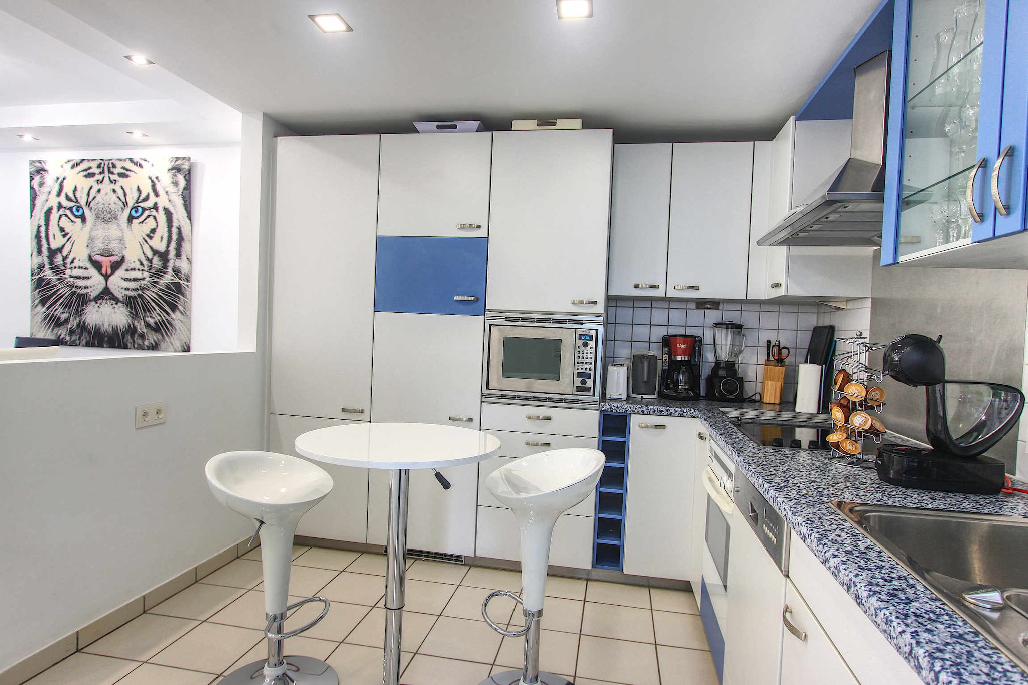 On the 1st floor: (open kitchen(hob(induction), electric kettle, toaster, coffee machine, oven, microwave, fridge-freezer, dishes and cutlery, Cooking basics), Living/diningroom(TV(flatscreen), dining table, seating area, DVD player), bedroom(double bed), bedroom(single bed, single bed), bedroom(double bed, double bed), bathroom(shower, washbasin, toilet, hairdryer), bathroom(shower, washbasin, toilet))\n\nOn the 2nd floor: (Bedroom with bathroom(double king size bed, bath tub, washbasin, toilet), Bedroom with bathroom(double king size bed, shower, washbasin, toilet))\n\nOn the 3rd floor: (bathroom(shower, washbasin, toilet), Bubble bath, roof terrace, sun loungers, lounge set)\n\nInternet access, Children pool, tumble dryer, cot, washing machine, balcony, heating, air conditioning, parking, swimming pool(private), fitness equipment, high chair, iron, Alarm