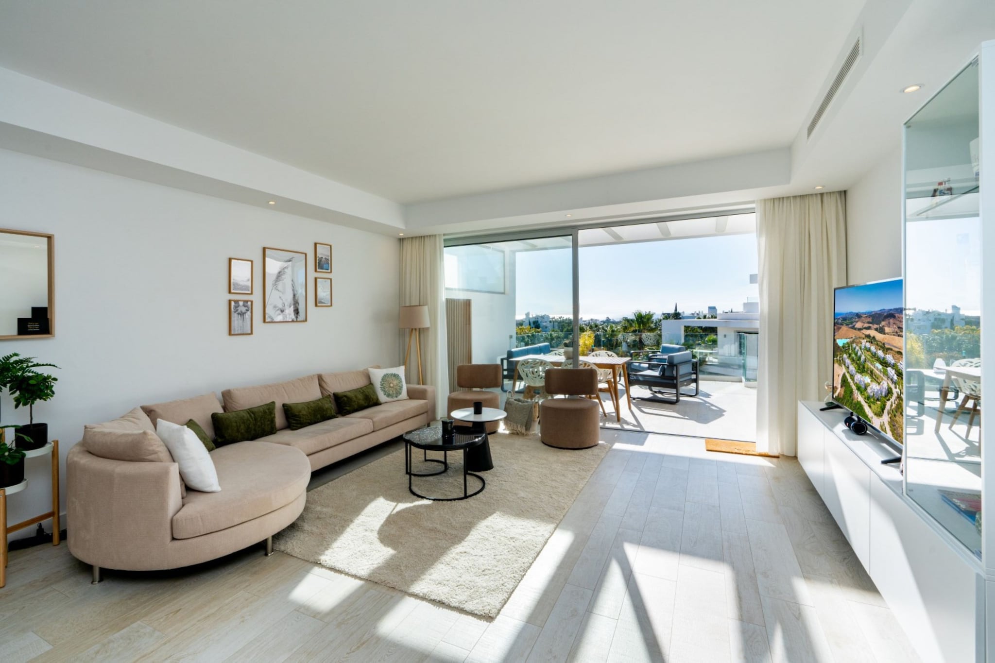 Wake up to relaxed resort living in this stylish apartment set within the popular Alcazaba Lagoon community in Casares near Estepona. Surrounded by landscaped gardens and modern Mediterranean architecture, the setting offers a calm Costa del Sol base for couples, families or friends looking to enjoy sunshine, leisure and nearby coastal attractions.

Inside, the first-floor apartment accommodates up to four guests across two bedrooms, including one bedroom with a king-sized bed and a second bedroom with two single beds. The bright living and dining area features comfortable seating, a TV and a dining table for shared meals. A well-equipped kitchen supports everyday cooking during your stay. The apartment includes two bathrooms, one with a bathtub and toilet and another with a shower and toilet. Air conditioning, heating, internet access, elevator access and a washing machine add convenience throughout the property.

Step outside onto the balcony and terrace where garden furniture creates a relaxing outdoor space for morning coffee or warm Mediterranean evenings. Guests also enjoy access to shared resort facilities including a swimming pool, children's pool, landscaped gardens and wellness amenities such as a fitness room, hot tub and sauna. Parking is available within the complex.

Alcazaba Lagoon is known for its turquoise lagoon and laid-back resort atmosphere. The beaches and charming old town of Estepona are a short drive away, offering seaside promenades, restaurants and boutiques along the Costa del Sol.