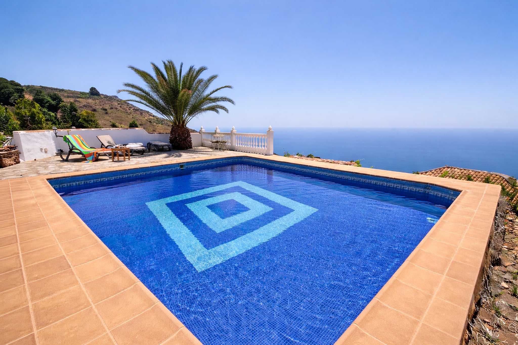 Enjoy the sunshine and easy coastal charm of Vera, a relaxed destination on Spain’s Almería coast known for its long sandy beaches and laid-back Mediterranean atmosphere. This welcoming holiday apartment offers a comfortable base for couples, families or friends looking to enjoy beach days, warm evenings and the slow rhythm of seaside living.
Inside, the apartment provides a bright and functional living space designed for a relaxed stay. The living and dining area includes comfortable seating and a TV, creating a pleasant place to unwind after time at the beach. A fully equipped kitchen allows guests to prepare meals with ease. The sleeping arrangement includes a comfortable double bedroom, along with an additional bedroom with twin beds, while a modern bathroom ensures everyday convenience. Air conditioning, washing facility and Wi-Fi are available for added convenience throughout the stay.
Step outside and enjoy the private terrace, providing an inviting spot for morning coffee or relaxed evening drinks, along with a garden with outdoor seating. Guests have access to a shared swimming pool surrounded by space to relax under the Spanish sun, perfect for refreshing dips during warm afternoons. Parking is also available, adding convenience for guests travelling by car.
Vera’s beautiful beaches are just a short distance away, offering golden sands and clear waters ideal for swimming and sunbathing. The nearby Vera Playa promenade features cafés, restaurants and seaside bars, while the charming towns of Mojácar and Garrucha invite day trips filled with scenic views, fresh seafood and authentic Andalusian culture.