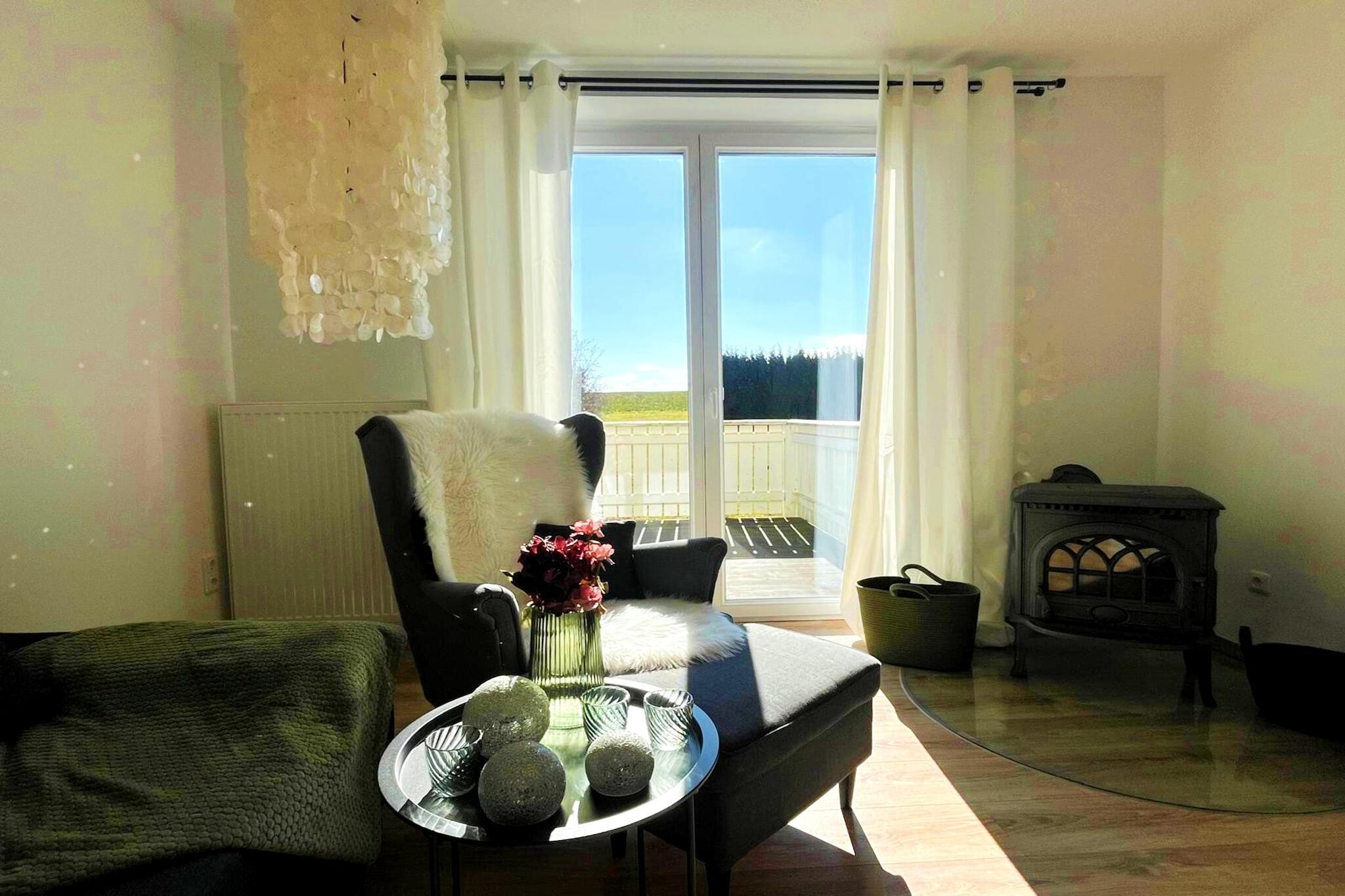 Living room(double sofa bed, TV, fireplace), Kitchen(dining table, electric kettle, cooker, coffee machine, oven, dishwasher, fridge-freezer), bedroom(double bed), bathroom(bath tub), balcony, parking, dishes and cutlery
