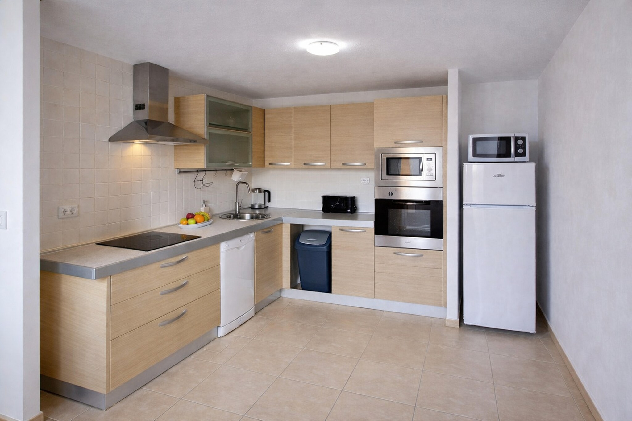Ground floor: (Entrance(reachable from the outside), open kitchen(hob, electric kettle, toaster, hood, coffee machine, oven, microwave, dishwasher, fridge-freezer), Living/diningroom(TV(flatscreen), dining table, seating area), bedroom(double bed), bedroom(double bed), bathroom(shower, washbasin, toilet, washing machine), bathroom(shower, washbasin, toilet), garden doors, air conditioning, air to air heatpump)\n\ngarage(shared with other guests, reachable from the outside), deckchairs, swimming pool(shared with other guests, outside, opened from Jan upto and including Dec)
