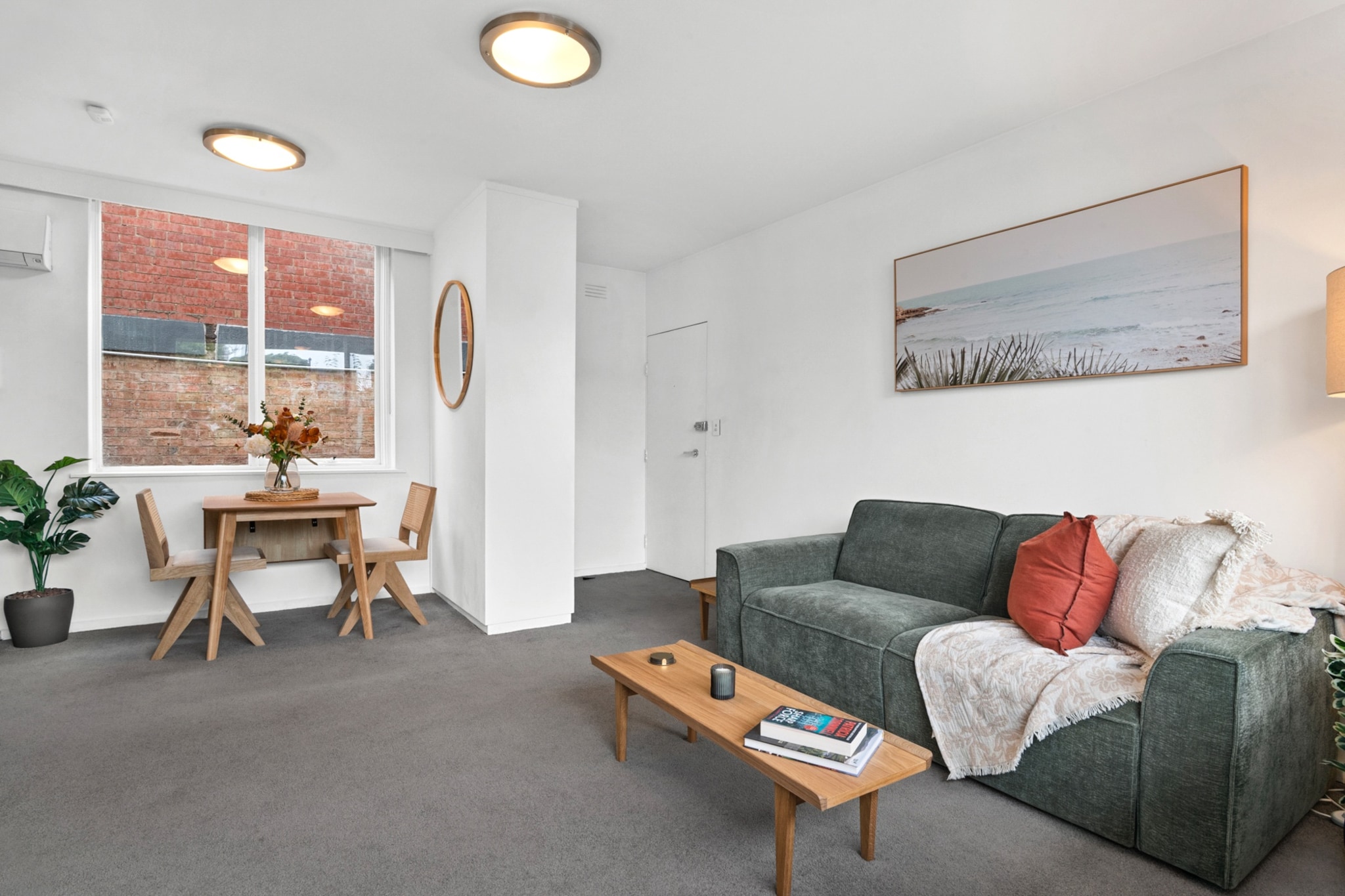 Property description
Positioned in vibrant St Kilda, this 1-bedroom apartment offers relaxed coastal living just moments from cafés, shops and the beach. Enjoy a private balcony, open-plan living, split system air conditioning in the lounge, and a dedicated open car space. Self check-in is via an offsite Keynest store, providing a smooth and secure arrival.
The space
This comfortable apartment combines simplicity with functionality, offering a welcoming base in one of Melbourne’s most iconic seaside suburbs. The living area is bright and neatly styled, with soft carpet underfoot and a two-seater sofa positioned perfectly for relaxing after a day exploring St Kilda. A coffee table and television complete the space, while artificial plants add a fresh decorative touch.
 
Adjacent to the lounge, a dining table with seating for two creates an intimate setting for meals or morning coffee. The kitchen is compact yet practical, equipped with a gas cooktop, electric oven, microwave and coffee machine, making it easy to prepare anything from quick breakfasts to evening dinners.
 
The bedroom features a queen bed dressed for comfort, with bedside tables and lamps for added convenience. Blackout blinds ensure restful sleep, while built-in storage with ample hangers keeps belongings organised. The en-suite bathroom is attached to the bedroom and includes a shower, vanity storage and essential amenities.
 
Step outside from the living room onto the private balcony, complete with outdoor furniture, offering a pleasant spot to enjoy fresh air and quiet moments.