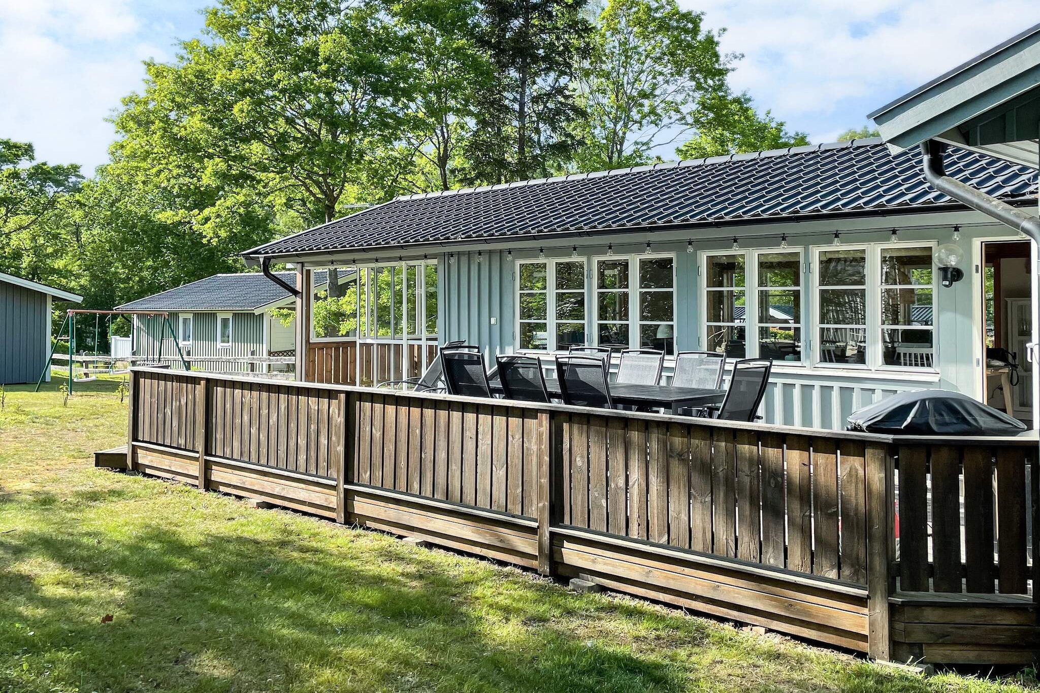 Welcome to a wonderful top-class holiday home with a seafront location – just 440 meters from the beach. A short walk through Saxnäs Camping leads you down to the popular bathing area with soft sandy beach and bathing jetties – perfect for both lazy days in the sun and a refreshing swim. Here you will live perfectly to be able to enjoy the peace and at the same time be able to enjoy the campsite's wide range of services and activities. Here you will find restaurants, a mini market and a lively summer program with live music, yoga, circuit training and football activities. There is mini golf, playgrounds, bicycles and bike carts, a multi-arena, an outdoor gym – something for all ages. The house offers a lovely, open plan layout where the kitchen and living room interact in a social and inviting environment. The fresh kitchen offers a high level of comfort. The living room has a beautiful dining area and a comfortable sofa group in front of the TV. There are two nice bedrooms, one bedroom is equipped with a double bed. The second bedroom is equipped with a double bed with two bunk beds above, which is ideal for families with children. The fresh bathroom is equipped with a combined washing machine and dryer for extra convenience during your stay. Outside, a large, lovely terrace awaits you with outdoor furniture and sun loungers - an obvious place for morning coffee in the sun or warm barbecue evenings. The fantastic outdoor room with high ceilings and generous space extends the summer and creates a bright and airy place to hang out regardless of the weather. On the plot there is a swing set and a large trampoline for the children. Please note that pets are not allowed. Bring your own sheets and towels. Not rented to youth groups. Here you live in a modern and comfortable house with the best location - close to the sea, the beach and activities. A perfect place to create unforgettable holiday memories.