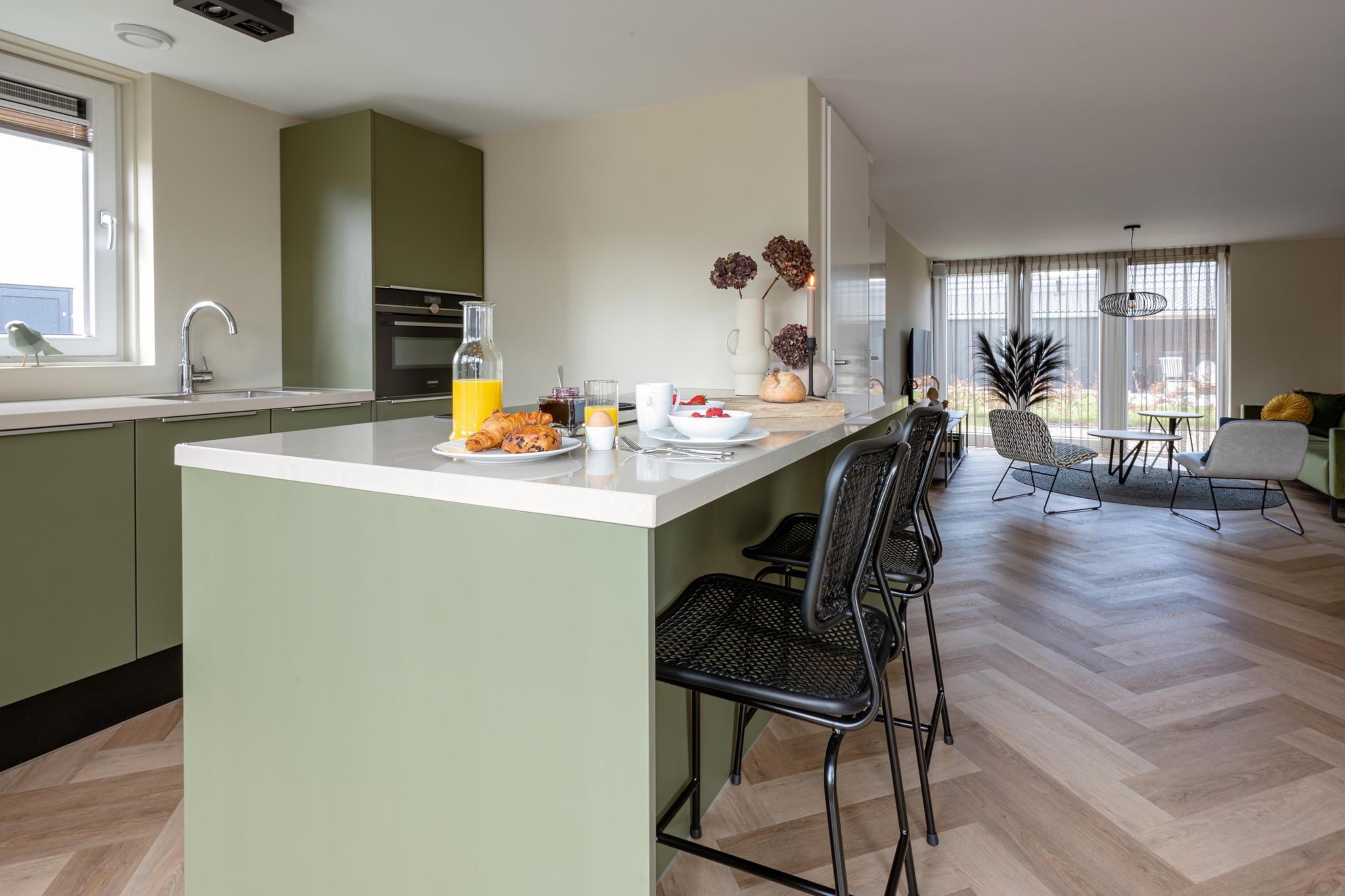 Ground floor: (open kitchen(stove, electric kettle, hood, coffee machine(cups), combination microwave, dishwasher, fridge-freezer, dishes and cutlery, Cooking basics), Living/diningroom(TV(flatscreen), dining table, seating area), Bedroom with bathroom(double bed, shower, washbasin, toilet), toilet(toilet))\n\nOn the 1st floor: (bedroom(double bed), bedroom(single bed, single bed), bathroom(shower, washbasin, washbasin, toilet), toilet(toilet))\n\nInternet access, tumble dryer, cot, sauna, washing machine, heating(central), terrace, garden, sun loungers, sun loungers, parking, trampoline, parasol, swimming pool(shared with other guests, outside), high chair, ironing board, iron, lounge set, Charging post for electric cars