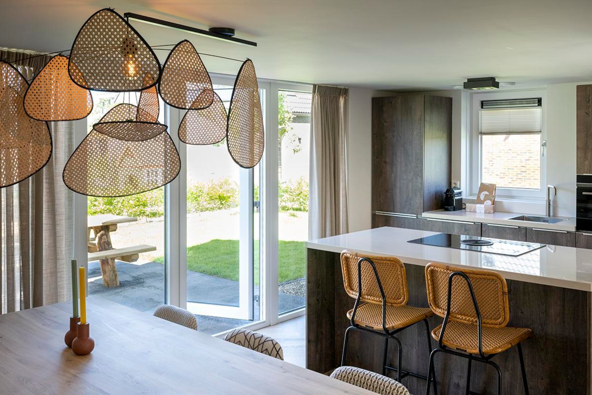 Ground floor: (open kitchen(stove, electric kettle, hood, coffee machine(cups), combination microwave, dishwasher, fridge-freezer, dishes and cutlery, Cooking basics), Living/diningroom(TV(flatscreen), dining table, seating area), Bedroom with bathroom(double bed, shower, washbasin, toilet), toilet(toilet))\n\nOn the 1st floor: (bedroom(double bed), bedroom(single bed, single bed), bathroom(shower, washbasin, washbasin, toilet), toilet(toilet))\n\nInternet access, tumble dryer, cot, sauna, washing machine, heating(central), terrace, garden, sun loungers, sun loungers, parking, trampoline, parasol, swimming pool(shared with other guests, outside), high chair, ironing board, iron, lounge set, Charging post for electric cars