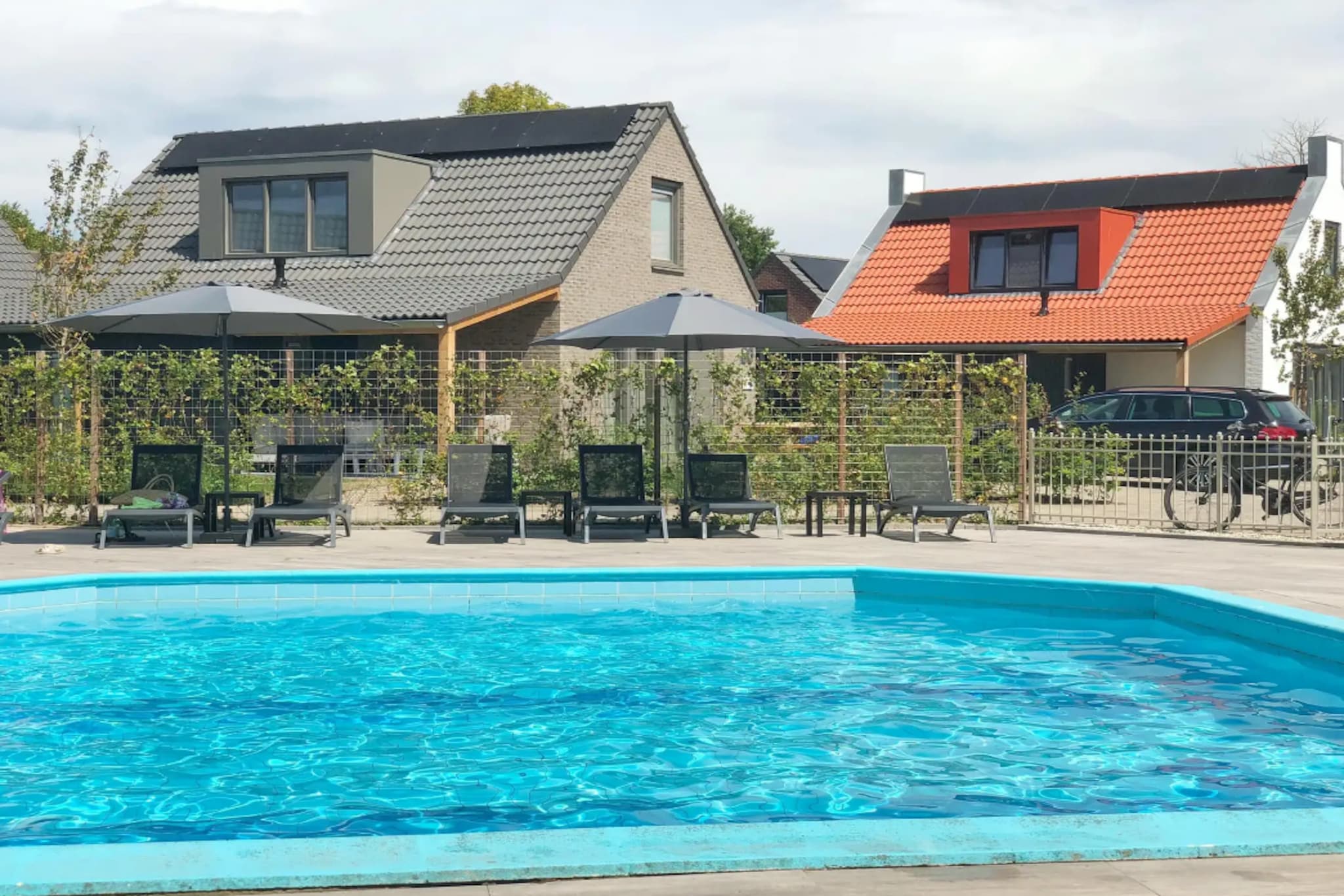 Set in a peaceful holiday park in Sint Maarten, North Holland, this modern coastal home offers a relaxing retreat for up to six guests, just a short distance from the North Sea beaches. Surrounded by open landscapes, small lakes and cycling routes, the property is ideal for families or groups seeking a balance of nature, comfort and easy coastal access.

Inside, the home is thoughtfully designed across two levels. The bright living room features a comfortable seating area, a television and dining space, creating a welcoming environment to unwind after a day outdoors. The fully equipped kitchen includes appliances such as a dishwasher, refrigerator, microwave and cooking facilities, allowing guests to prepare meals with ease. Additional conveniences such as free Wi-Fi and a washing machine support both short and extended stays.

The property includes three bedrooms and two bathrooms, comfortably accommodating up to six guests. One bedroom and a bathroom with a walk-in shower are located on the ground floor, while two double bedrooms and a second bathroom are situated upstairs, along with separate toilets for added convenience.

Step outside to a private terrace and fenced garden, where outdoor seating creates a pleasant space for relaxing or dining. A standout feature is the private barrel sauna, offering a wellness touch after active days. Guests can also enjoy shared park facilities, including a seasonal outdoor swimming pool, playground and sports areas.

Located around 6 km from the beach, and close to towns such as Schagen and Alkmaar, this home provides an excellent base for exploring the North Holland coast.