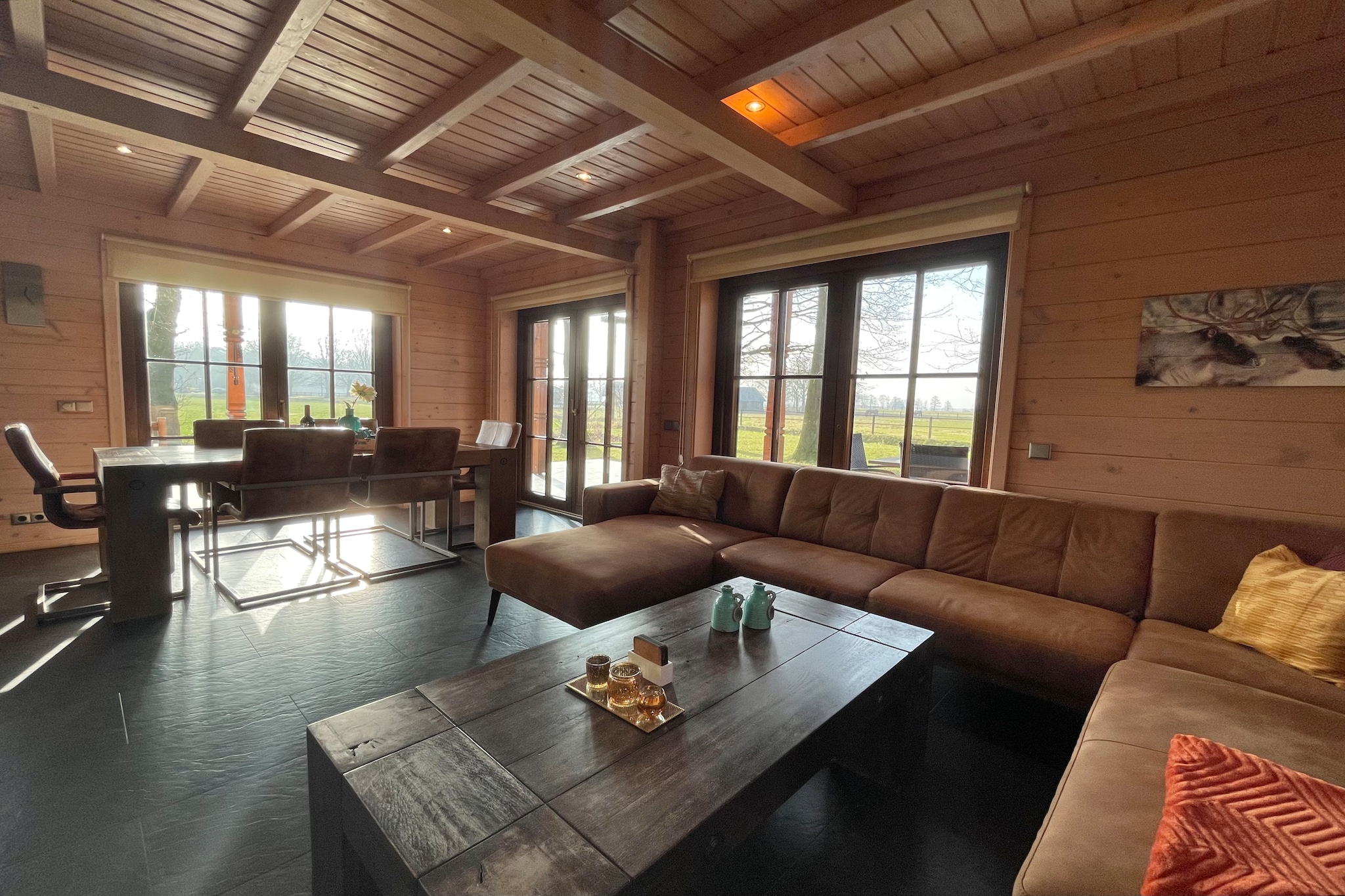 Experience the perfect balance of relaxation and nature in this sustainable, wooden holiday villa located on a quiet, small-scale park in Den Ham. Surrounded by the serene Salland landscape, this detached home offers a spacious 600 m² green plot with a wraparound veranda, perfect for soaking in the views. The heart of the home is a bright, open-plan living space featuring a central, double-sided gas fireplace that creates a warm, cozy atmosphere throughout the kitchen and lounge. Designed for comfort, the villa includes a modern kitchen with a spacious island, dishwasher, and various coffee machines, along with high-tech entertainment options like a soundbar with a subwoofer and a Smart TV with extensive sports channels.

Your well-being is prioritized here, with a private infrared sauna located in a separate building just steps from the main house. The primary bathroom is a spa-like retreat featuring underfloor heating, a luxury rain shower, and a relaxing whirlpool tub. The villa accommodates four guests across two comfortable bedrooms—one with two single beds and a very spacious second bedroom that can be partitioned with a roller shutter for added privacy. Thoughtful touches such as lime-free water, high-speed fiber-optic Wi-Fi, and included bed linen and towels ensure a seamless and worry-free stay for your entire group.

Adventure is right at your doorstep, with the Zandstuve Forest just a five-minute walk away, perfect for early morning wildlife spotting. Families will appreciate the proximity to popular attractions like Adventure Park Hellendoorn, Kartplaza Nijverdal, and Slagharen, all within a short drive.