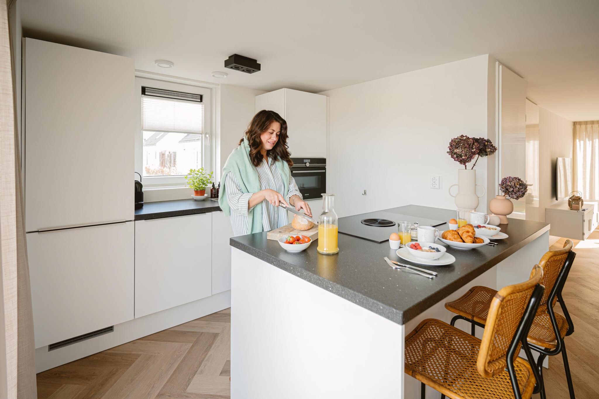 Ground floor: (open kitchen(stove, electric kettle, hood, coffee machine(cups), combination microwave, dishwasher, fridge-freezer, dishes and cutlery, Cooking basics), Living/diningroom(TV(flatscreen), dining table, seating area), Bedroom with bathroom(double bed, shower, washbasin, toilet), toilet(toilet), storage)\n\nOn the 1st floor: (bedroom(double bed), bedroom(double bed), bathroom(shower, washbasin, toilet), toilet(toilet))\n\nInternet access, tumble dryer, cot, washing machine, heating(central), terrace, garden, sun loungers, sun loungers, parking, trampoline, parasol, swimming pool(shared with other guests, outside), high chair, ironing board, iron, lounge set, Charging post for electric cars