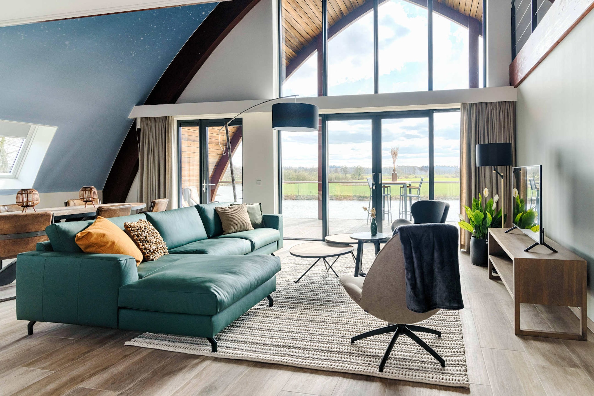 Indulge in a world of luxury and tranquility at this sophisticated wellness apartment, perched in a unique, scenic location directly along the banks of the Overijssel Vecht river. Meticulously designed with a modern, cozy aesthetic, the space features warm, fresh colors and large panoramic windows that frame stunning views of the surrounding nature. The apartment serves as a private wellness sanctuary, boasting an impressive array of features including a private steam cabin, massage bath, and Finnish sauna inside, while the shared outdoor wellness garden invites you to further pamper yourself with an additional hot tub, infrared sauna, and a second Finnish sauna.

The layout is perfectly tailored for a romantic escape, featuring a bright, airy living space with a smart TV and a designer open kitchen equipped with a Quooker, steam oven, and induction cooktop. Ascend to the lofted sleeping area, where an open-concept bedroom offers a dreamy, panoramic view of the natural landscape, perfect for waking up in peace. Guests can enjoy quiet mornings on the covered terrace or indulge in personalized services such as delivered regional dinners, extended breakfasts, or holistic massages, making every aspect of your stay effortless and restorative.

Dalfsen, known as the "Green Pearl on the Vecht," is an ideal base for those who appreciate both natural beauty and cultural charm. You are perfectly positioned to explore the diverse Vechtdal region, with its rolling hills, expansive heathlands, and historic estates.