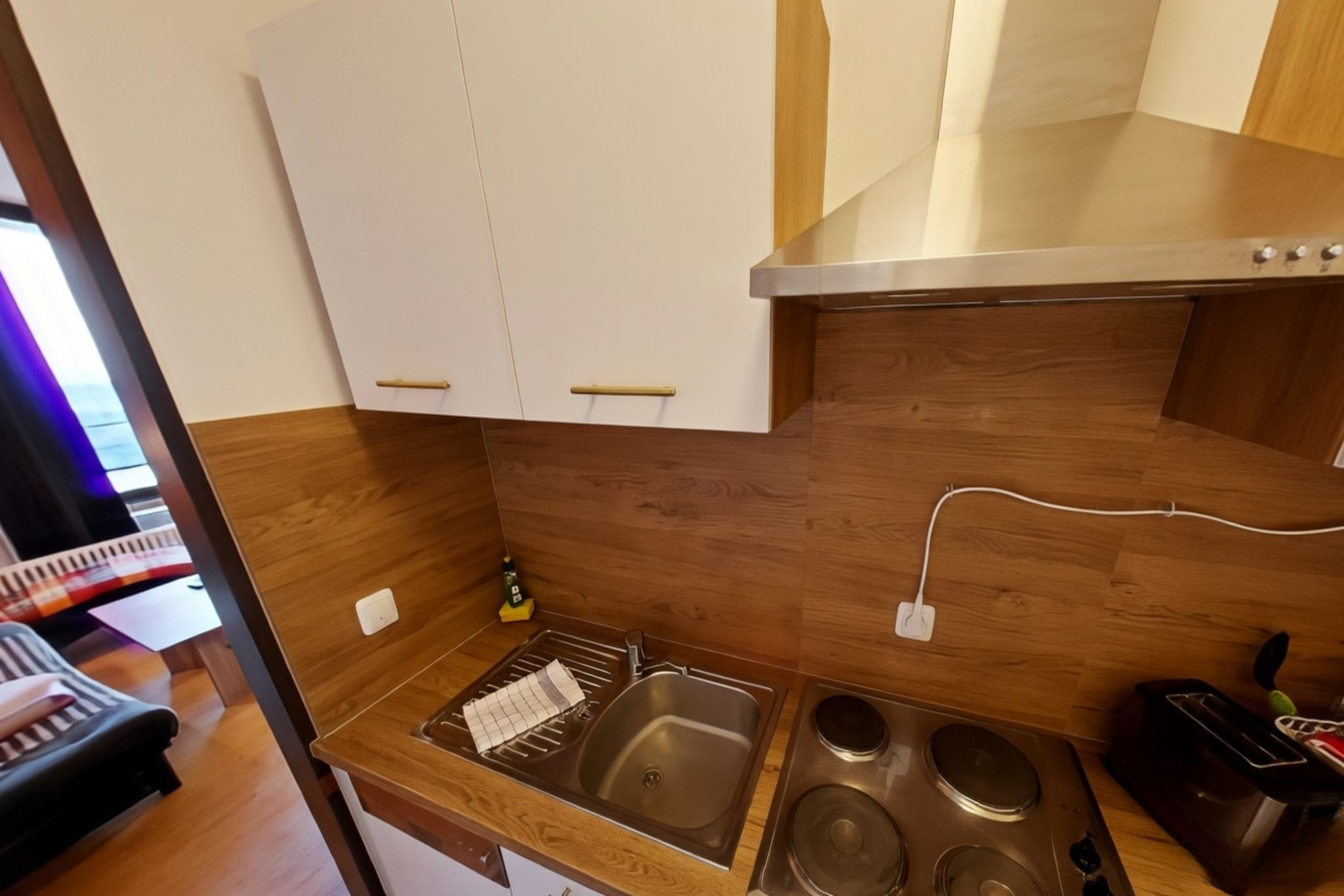 On the 2nd floor: (Kitchen(hob(4 ring stoves, electric), electric kettle, toaster, coffee machine, microwave, dishwasher, fridge(+ freezer)), Living/bed room(single sofa bed, double fold-away bed, TV), bathroom(shower, washbasin, toilet, hairdryer), balcony)\n\ngarage, tumble dryer(paid), cot, sauna(shared with other guests), washing machine(paid), garden, garden furniture, parking, swimming pool(shared with other guests, indoor), play equipment, slide, lift, toys, Swing set, Charging post for electric cars, Towels/Sheets (Incl.)