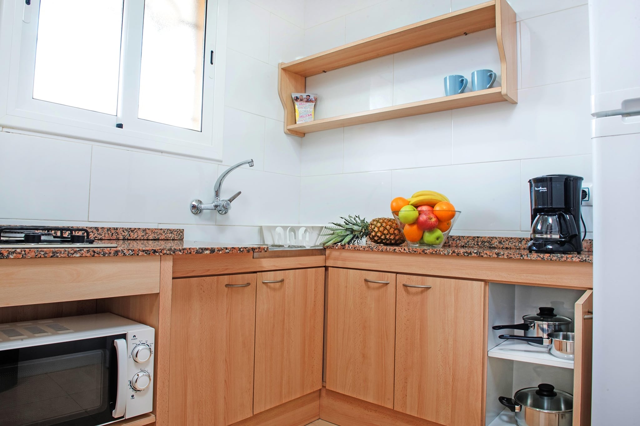 Ground floor: (Entrance(reachable from the outside), open kitchen(cooker(2 ring stoves), coffee machine, microwave, fridge), Living/diningroom(single folding bed, single sofa bed, TV(satellite), seating area, air conditioning), bedroom(single bed(90 x 190 cm), single bed(90 x 190 cm)), bedroom(double bed or 2 single beds), bathroom(bathtub with shower, washbasin, toilet))\n\ncot, balcony or terrace, garden furniture, parking, swimming pool(shared with other guests, opened from Jan upto and including Dec)