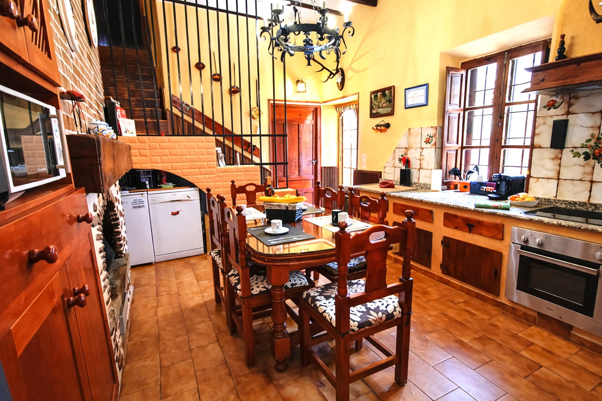 Ground floor: (Entrance(reachable from the outside), Large kitchen(dining table, fireplace, hob, hood, coffee machine, oven, microwave, dishwasher, fridge-freezer), Living/diningroom(25 m2)(TV, seating area), bedroom(double bed(135 x 190 cm)), bedroom(double bed(135 x 190 cm)), bedroom(double bed(135 x 190 cm)), bathroom(shower, washbasin, toilet, bidet, hairdryer), recreation room(table tennis table, table football, darts), dining table, patio, air conditioning, BBQ(charcoal), heating)\n\nOn the 1st floor: (Living room(35 m2)(TV, dining table, seating area, bar, dishwasher, air conditioning), bedroom(single bed(105 x 190 cm), single bed(105 x 190 cm), single fold-away bed), Bedroom with bathroom(single bed(105 x 190 cm), single bed(105 x 190 cm), single fold-away bed, bathtub or shower, washbasin, toilet, hairdryer), bathroom(massage shower, washbasin, toilet, hairdryer), air conditioning, heating)\n\nBasement: (recreation room(dining table, Wine glasses))