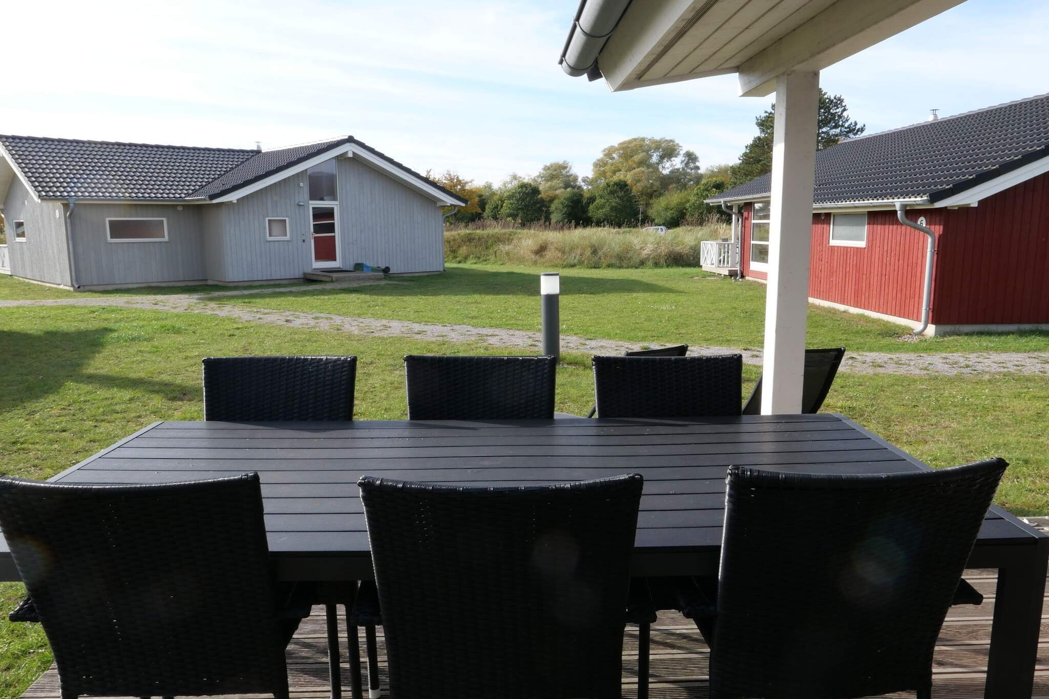 Experience a restorative escape at the Holiday Vital Resort Großenbrode in this exceptionally spacious 96m² Scandinavian-style holiday home, perfectly located near the beautiful Baltic Sea beaches. Designed for up to ten guests and two dogs, this detached villa combines a modern, bright atmosphere with a clever layout that offers both social spaces and privacy. The heart of the home is the expansive, open-plan living area featuring a cozy wood-burning stove and a large dining table for shared culinary highlights. Large windows invite natural light to flood the space, while direct access to the partially covered terrace allows you to enjoy long summer evenings in the fresh coastal air. The accommodation is thoughtfully divided into two separate sleeping wings to ensure maximum comfort for families or groups traveling together. Each wing features a bedroom with a double bed and a second bedroom with two single beds, with an additional cozy sleeping loft that is always a favorite for children. Two modern bathrooms, both equipped with underfloor heating, serve the property; the larger bathroom offers a private sauna and shower, providing a perfect sanctuary to unwind after a day by the sea. Every detail has been curated for a stress-free stay, including a fully equipped kitchen with a dishwasher, a washing machine with a drying function, and essential child-friendly amenities like a cot and high chair. Outdoor living is a standout highlight, with a spacious terrace furnished for al fresco dining and sun loungers for relaxation. The villa is nestled within the lush greenery of the park, just a short walk from the coast and a wealth of recreational facilities, including sports fields and a nearby supermarket. For those traveling with pets, up to two furry friends are welcome to join the holiday for a fee of 40 EUR per pet per stay. Please note that bed linen is also a mandatory service at this resort and is provided at a rate of 24 EUR per person to ensure a seamless arrival. Whether you are warming up by the fire or exploring the scenic coast, this versatile Scandinavian retreat offers a sophisticated and comfortable base for an unforgettable holiday.