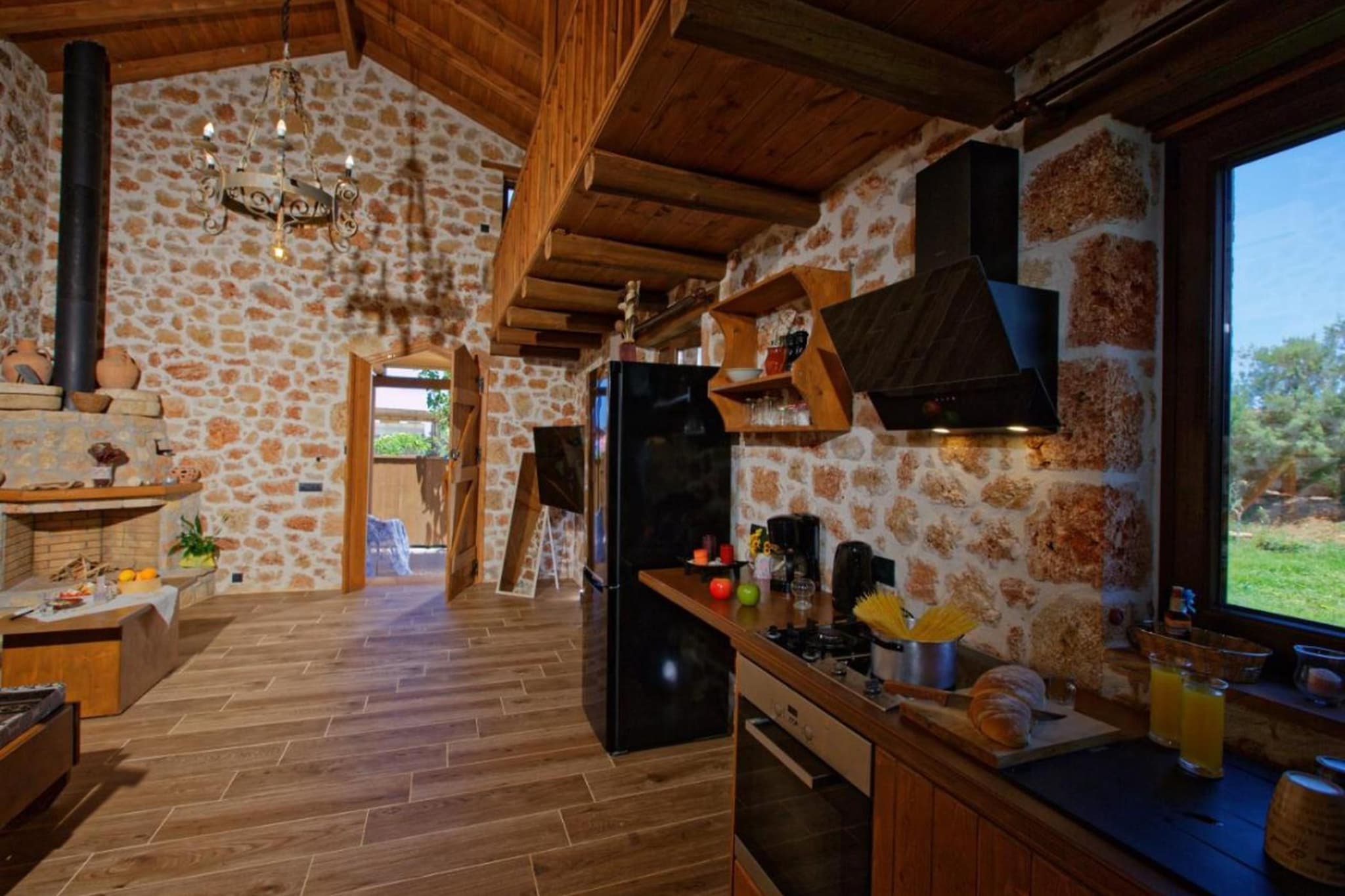 Ground floor: (open kitchen(stove, electric kettle, toaster, coffee machine, oven, fridge-freezer, dishes and cutlery, Cooking basics), Living/diningroom(single sofa bed, single sofa bed, TV(cable, flatscreen), dining table, fireplace, seating area), bathroom(bath tub, shower, washbasin, toilet, hairdryer))\n\nOn the 1st floor: (bedroom(double bed))\n\nInternet access, hot tub, sauna, washing machine, balcony, patio, heating, air conditioning, terrace, garden, garden furniture, BBQ, parking, iron, Cleaning products