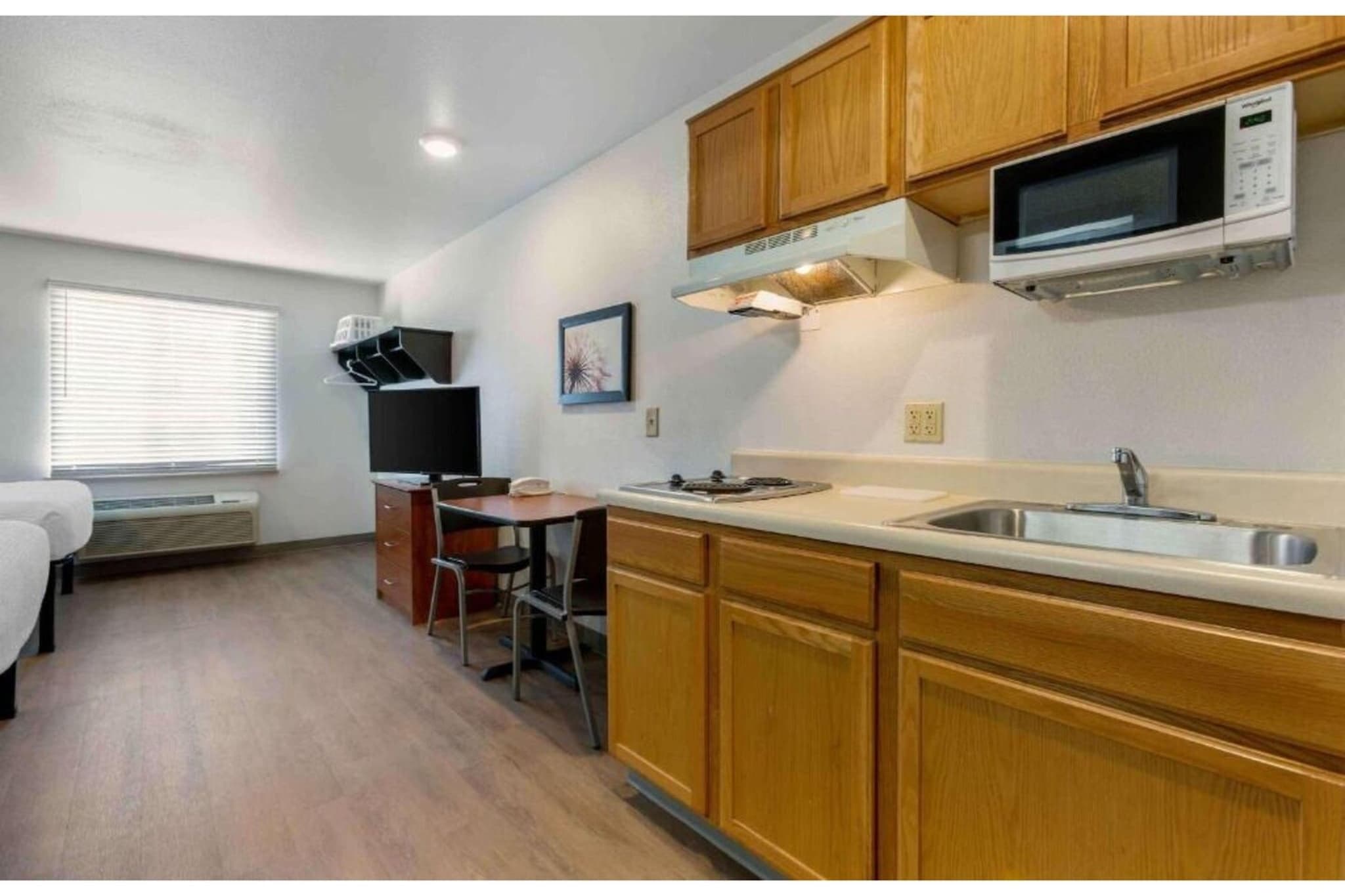 Ground floor: (Kitchen(microwave, fridge), bedroom(TV, air conditioning, telephone, Queen Bed), bathroom(shower, toilet))\n\nparking, heating