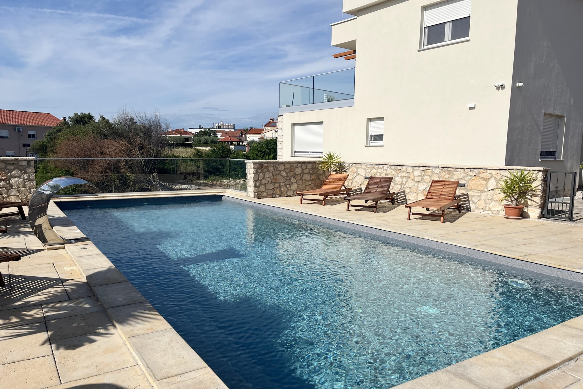 The apartment in Zaton has 2 bedrooms and capacity for 4 persons. Accommodation of 83 m² nice and is a new build. The property is located 650 m sand beach "Plaža Pliša", 650 m rock beach, 650 m the restaurant, 650 m coffee shop, 3 km city "Nin", 4 km supermarket "Supermarket Plodine", 14 km hospital "Opća bolnica Zadar", 26 km international airport "ZL Zadar", 26 km airport "ZL Zadar", 50 km nature reserve "NP Paklenica" and it is located in a a family-friendly zone and close to a shopping area and restaurants. The accommodation is equipped with the following items: garden, outdoor furniture, fenced plot, terrace, washing machine, barbecue, iron, internet (Wi-Fi), hair dryer, balcony, electric heating, air-conditioned, swimming pool communal, heated swimming pool communal, open-air parking in the same building, mosquito nets throughout the accommodation, 3 TVs. The open plan kitchen, electric, is equipped with refrigerator, microwave, oven, freezer, dishwasher, dishes/cutlery, kitchen utensils, coffee machine, toaster and kettle.