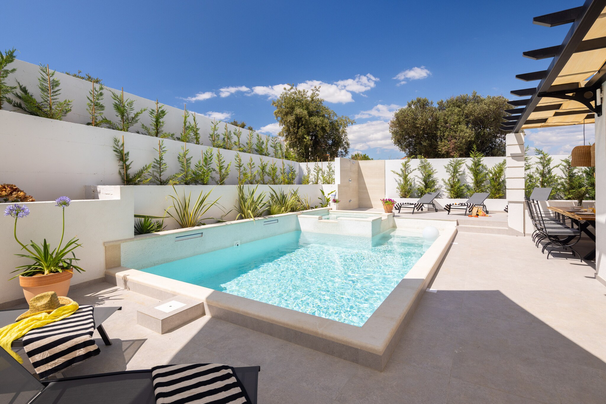 The villa in Ražanj has 4 bedrooms and capacity for 8 persons. Accommodation of 200 m² nice and is modern, It has waterfront and garden. The property is located 300 m rock beach, 400 m city, 400 m supermarket, 400 m the restaurant, 400 m coffee shop, 13 km hospital "Dom zdravlja Marina", 33 km international airport "ZL Split", 33 km airport "ZL Split", 50 km nature reserve "NP Krka" and it is located in a a family-friendly zone and close to a shopping area and restaurants. The accommodation is equipped with the following items: garden, outdoor furniture, fenced plot, terrace, washing machine, barbecue, fireplace, iron, internet (Wi-Fi), hair dryer, indoor hot-tub, central heating, air-conditioned, swimming pool private, heated swimming pool private, open-air parking in the same building, mosquito nets throughout the accommodation, 5 TVs, satellite tv (Languages: Spanish, English, German, Dutch, French). The open plan kitchen, electric, is equipped with refrigerator, oven, freezer, dishwasher, dishes/cutlery, kitchen utensils, coffee machine, toaster and kettle.